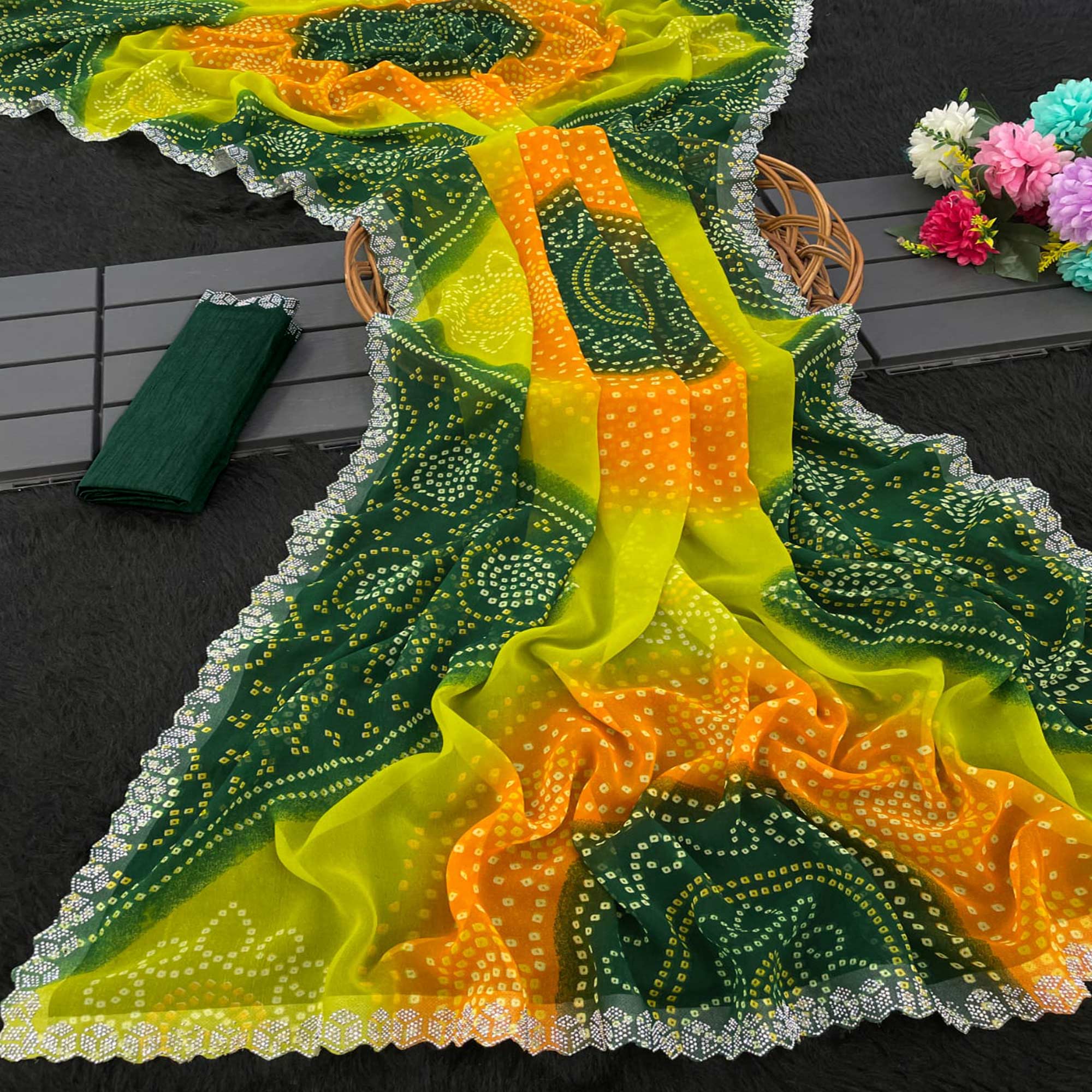 Green & Orange Georgette Saree With Traditional Bandhani Print And Sparkling Stone Work Border