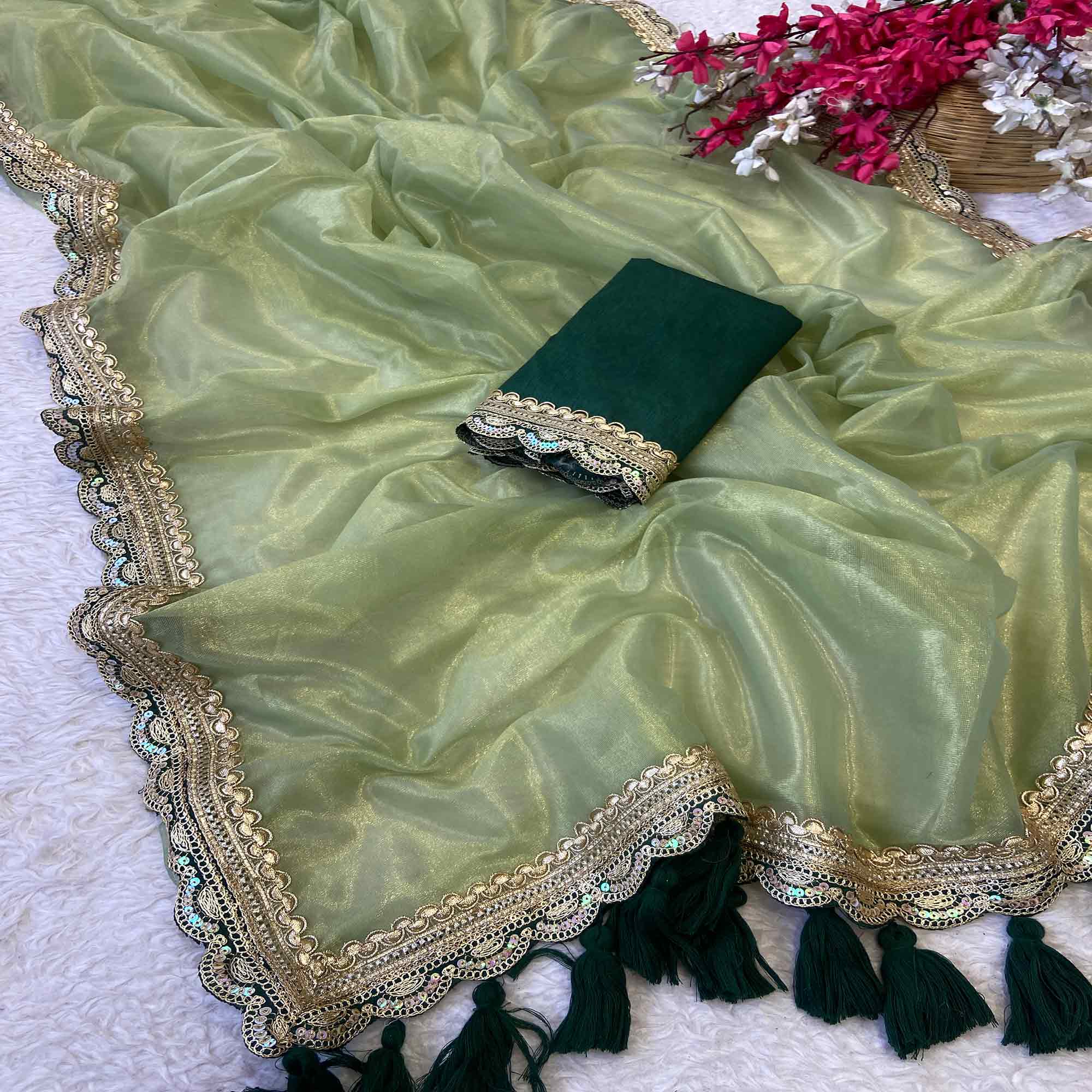 Pista Green Net Saree With Intricate Sequin Embroidery & Tassel Embellished Pallu