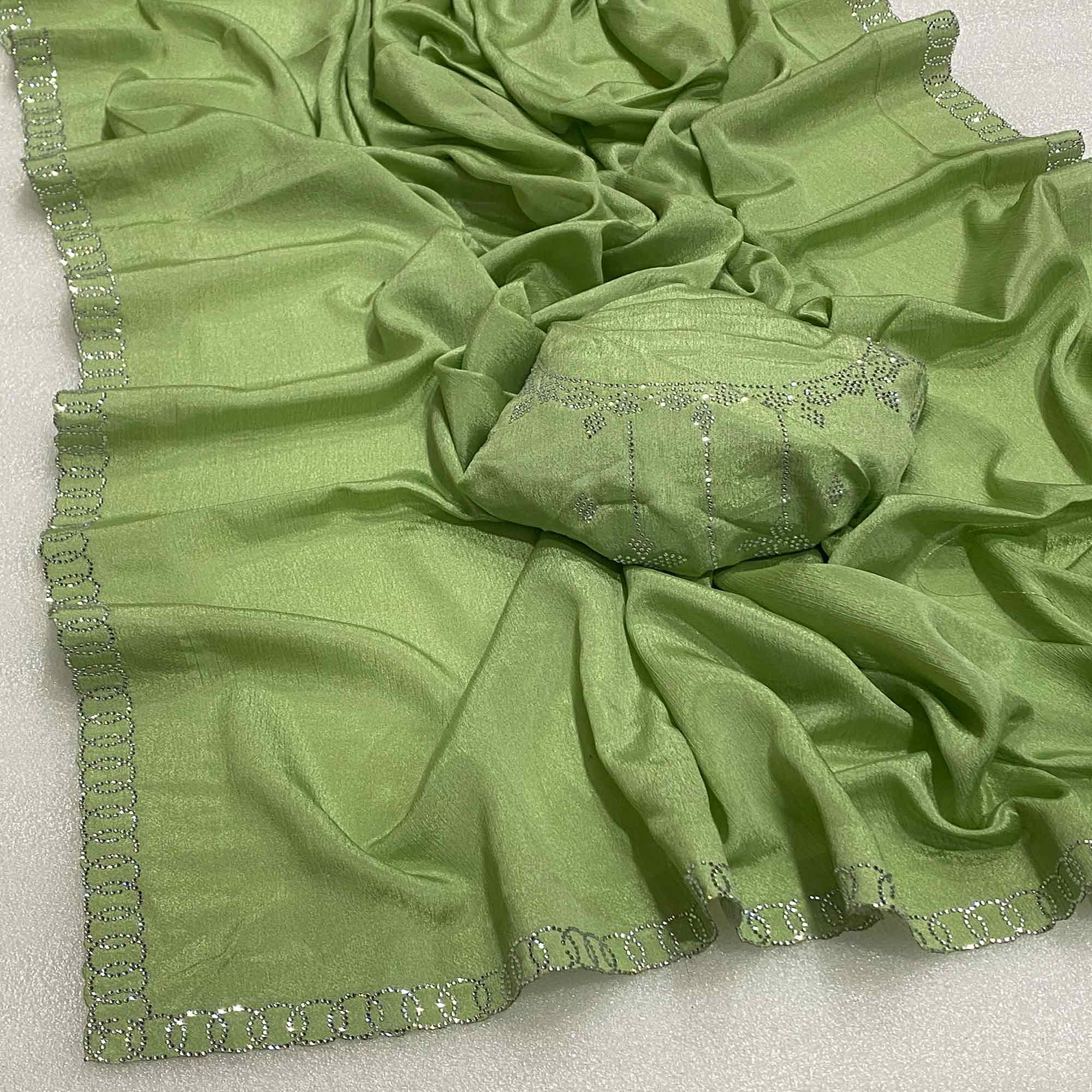 Green Embellished Silk Blend Saree Featuring Fine Swarovski Stone Detailing