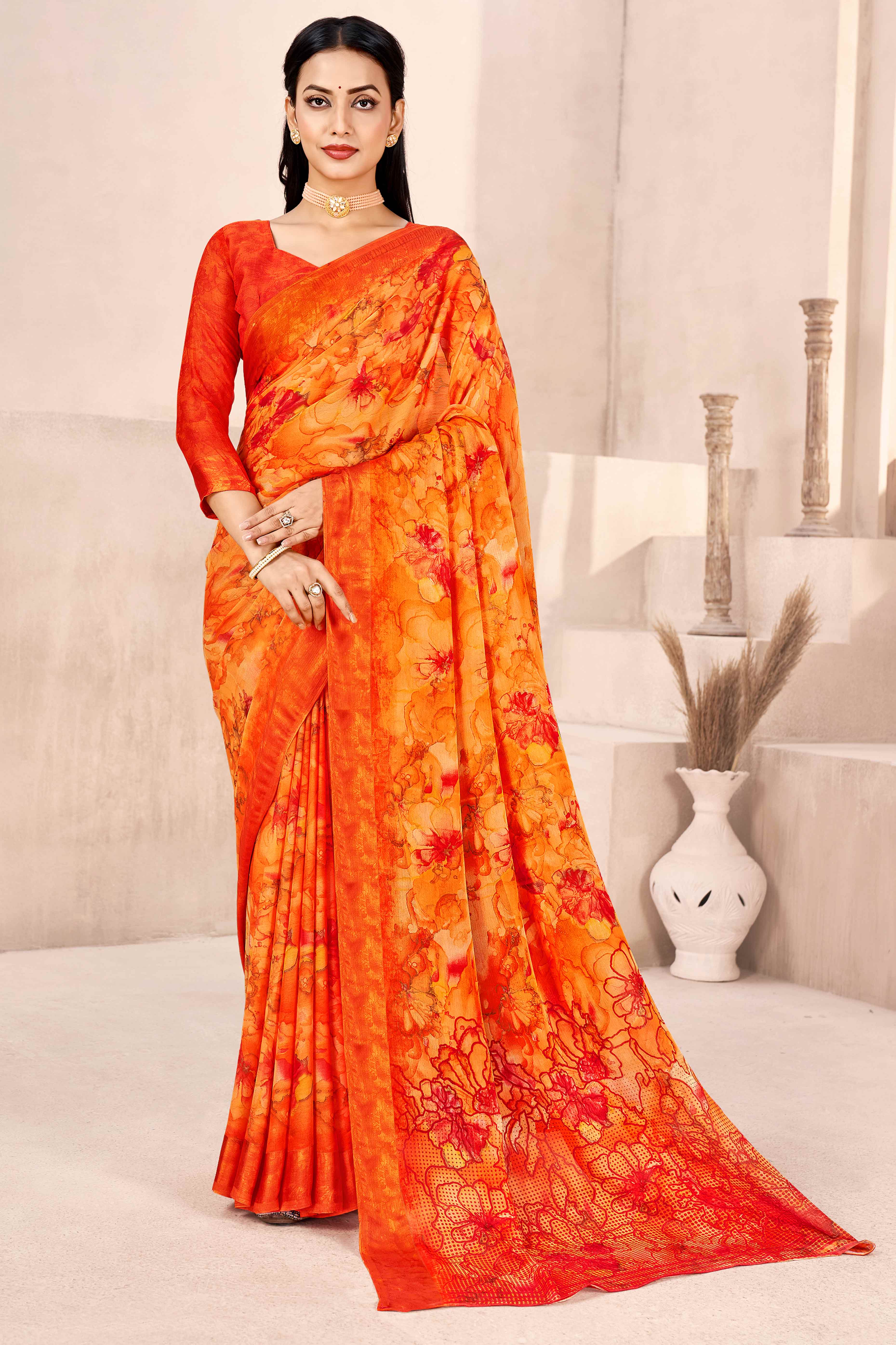 Orange Chiffon Saree With Delicate Floral Prints & Elegant Woven Border