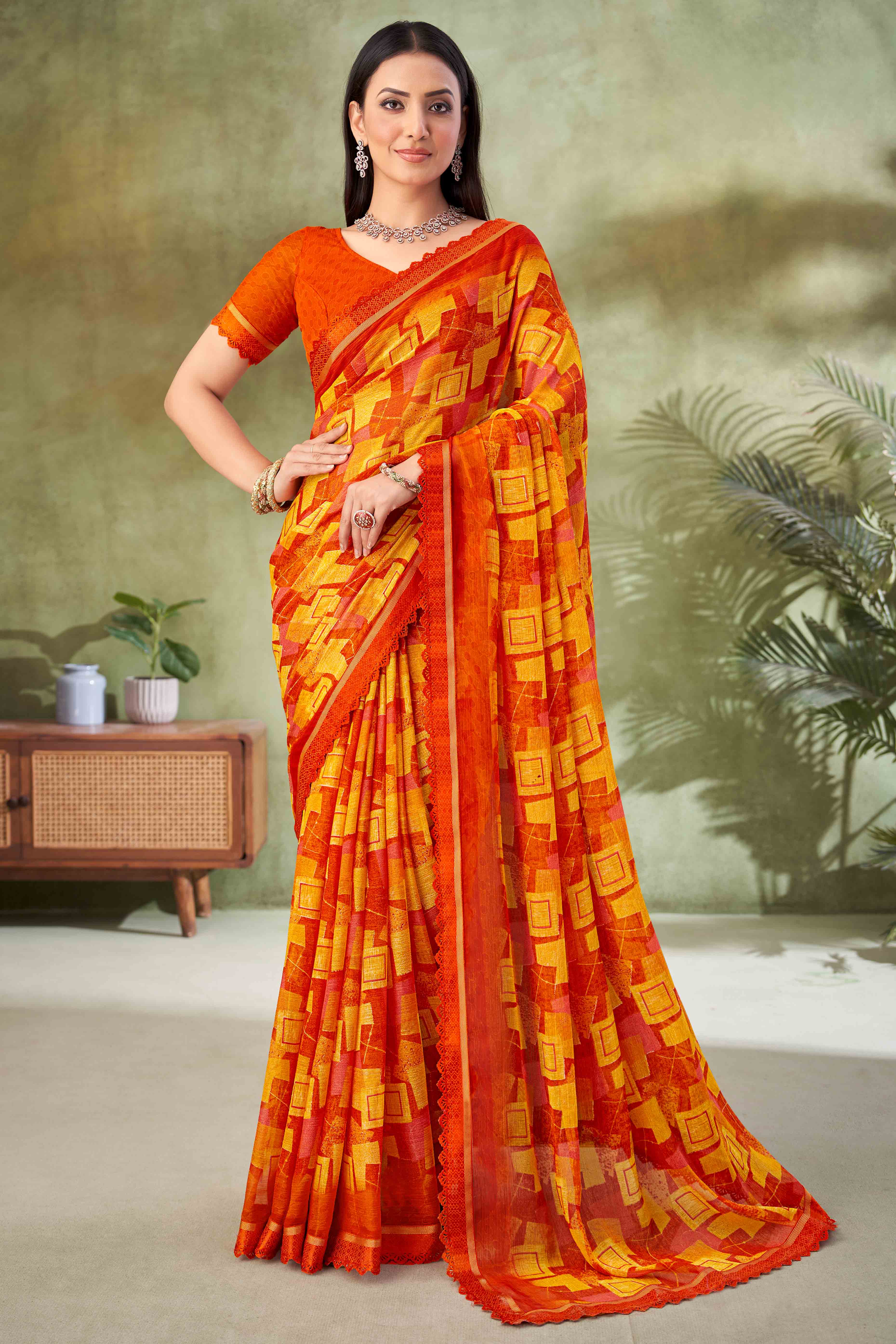 Orange Digital Printed Chiffon Saree Accented With Elegant Lace Border