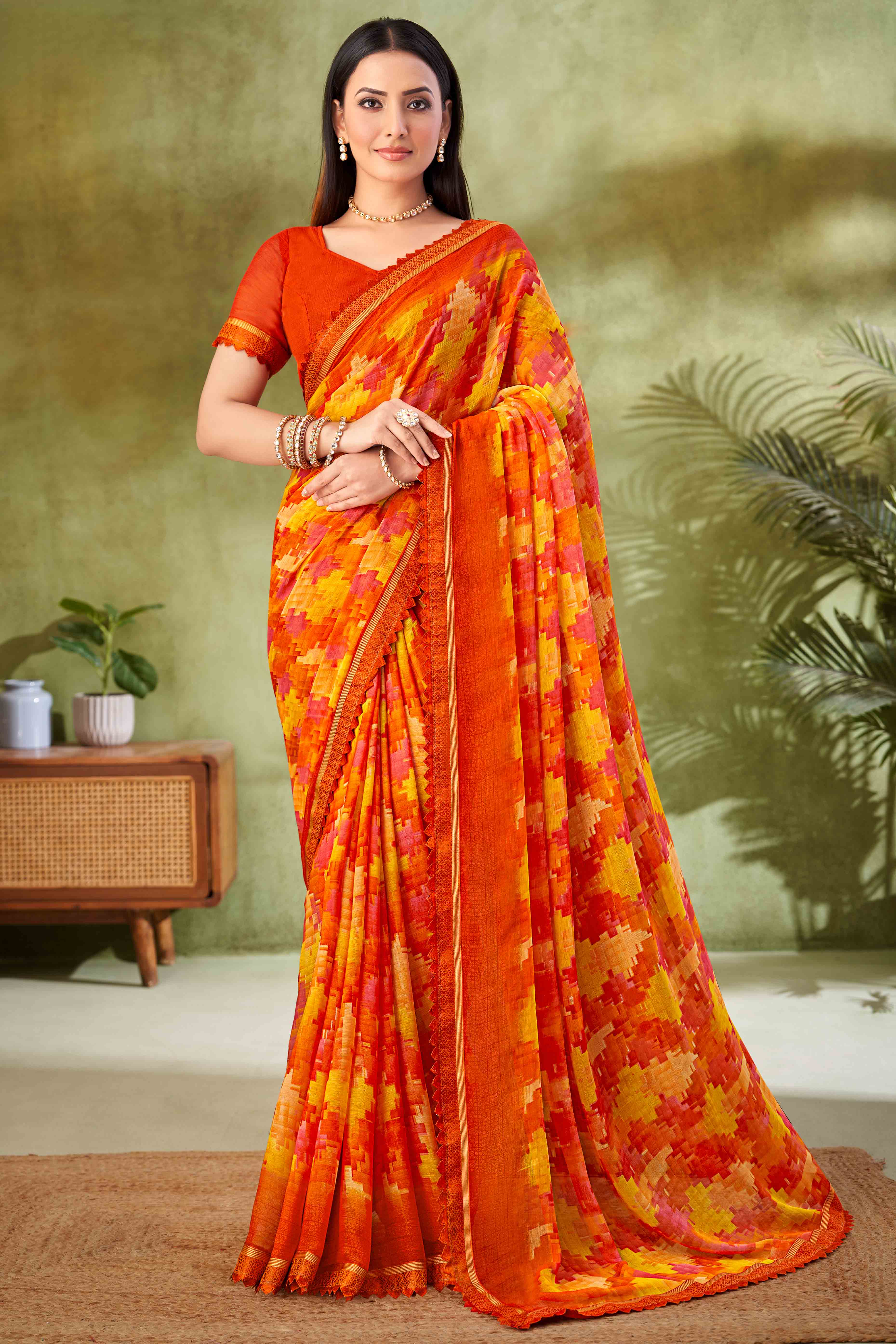 Orange Digital Printed Chiffon Saree Accented With Elegant Lace Border