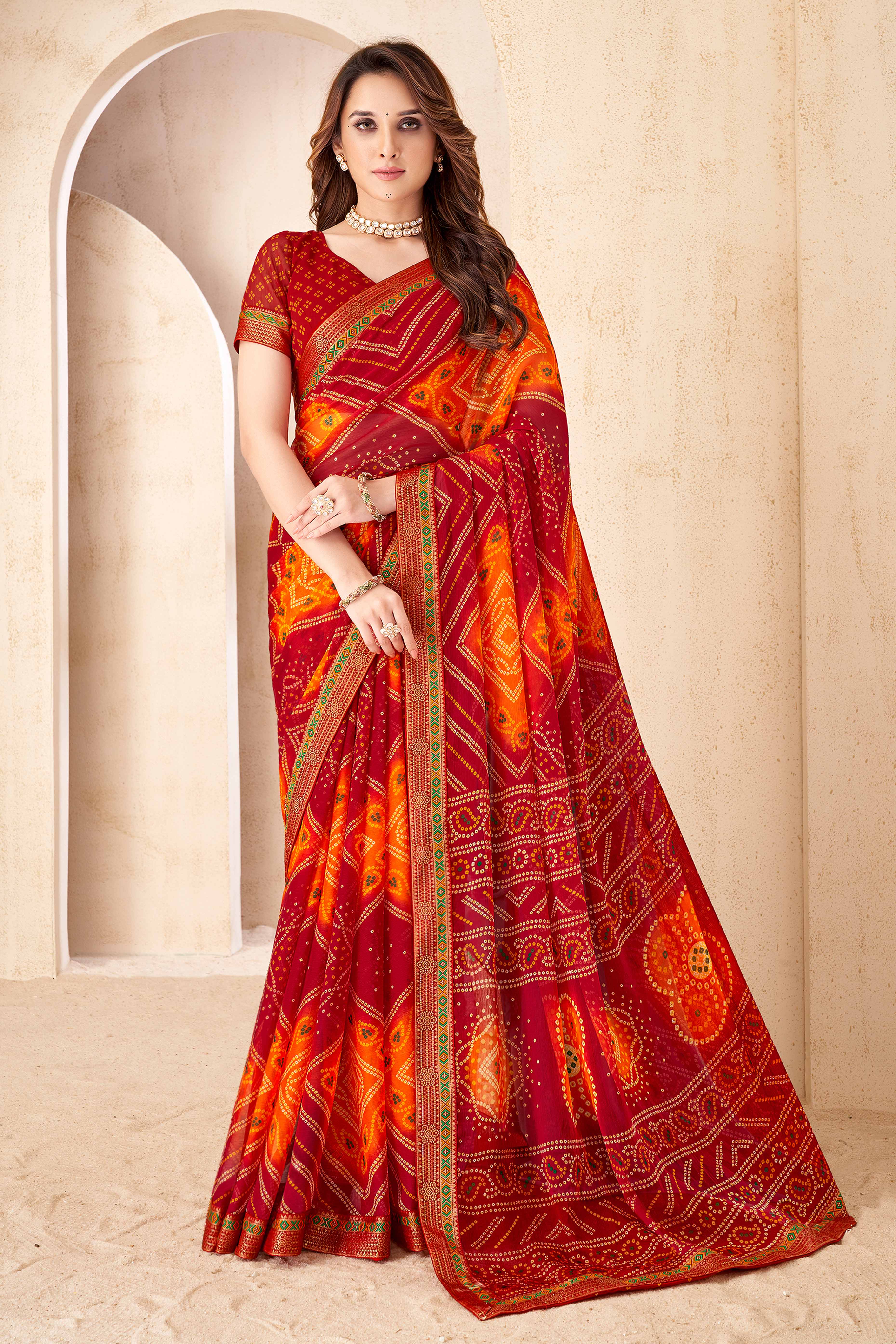 Maroon & Orange Bandhani Printed Chiffon Saree Enhanced with Delicate Lace Border Work