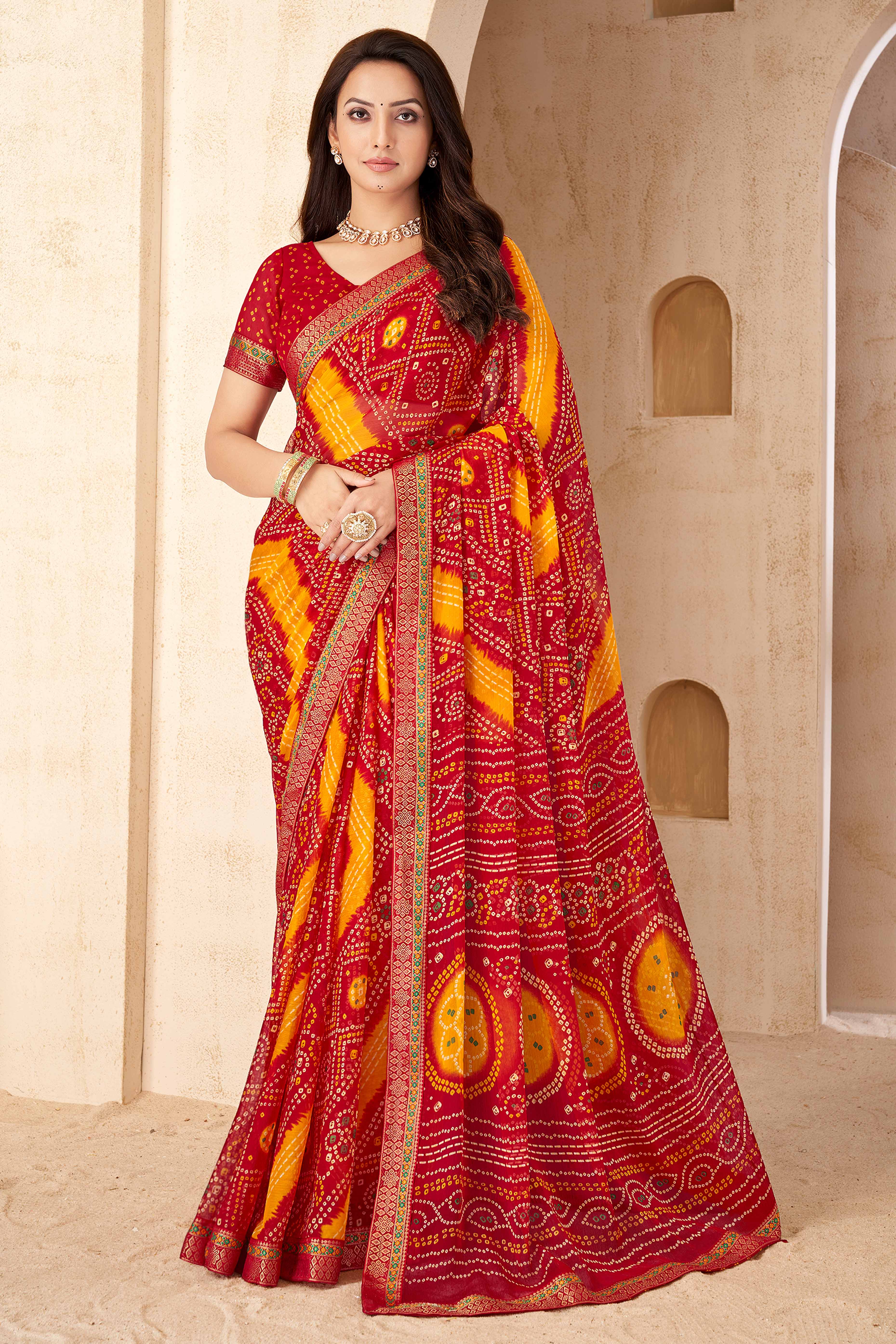 Red & Mustard Bandhani Printed Chiffon Saree Enhanced with Delicate Lace Border Work