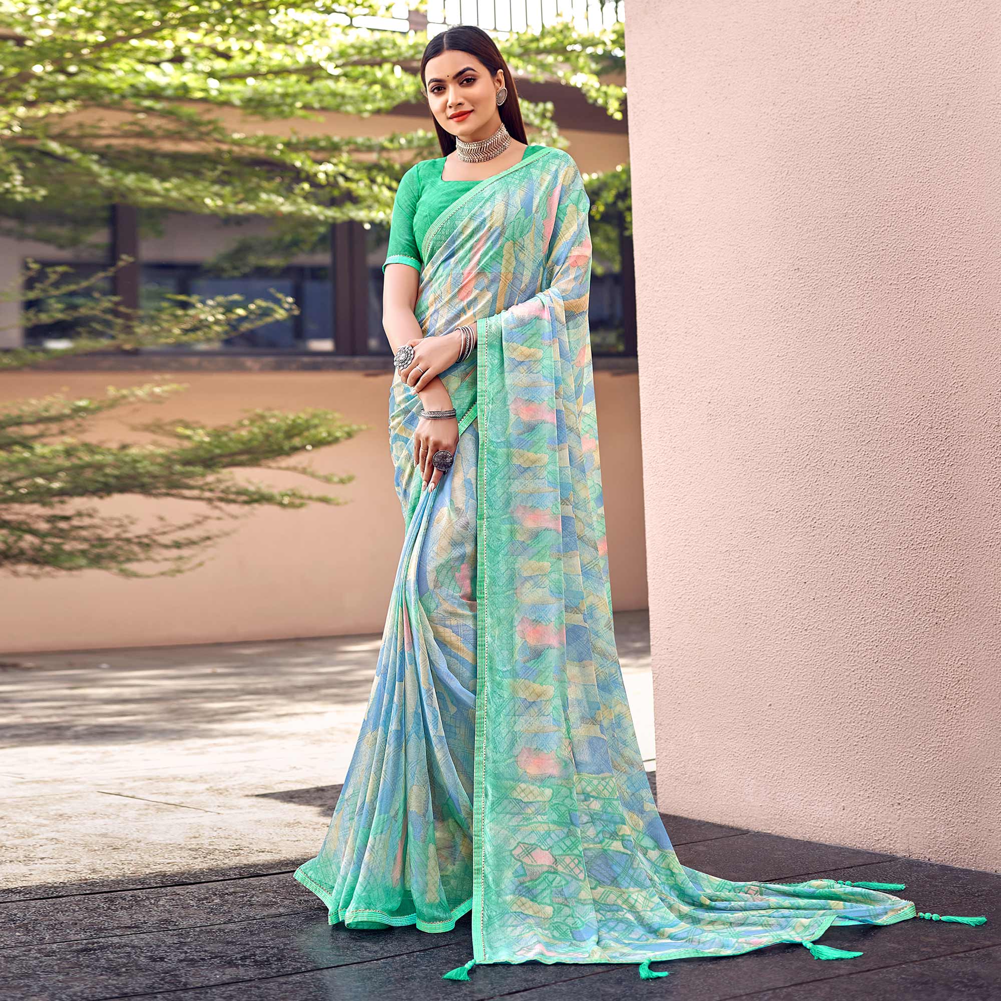 Turquoise Printed Chiffon Saree With Tassels