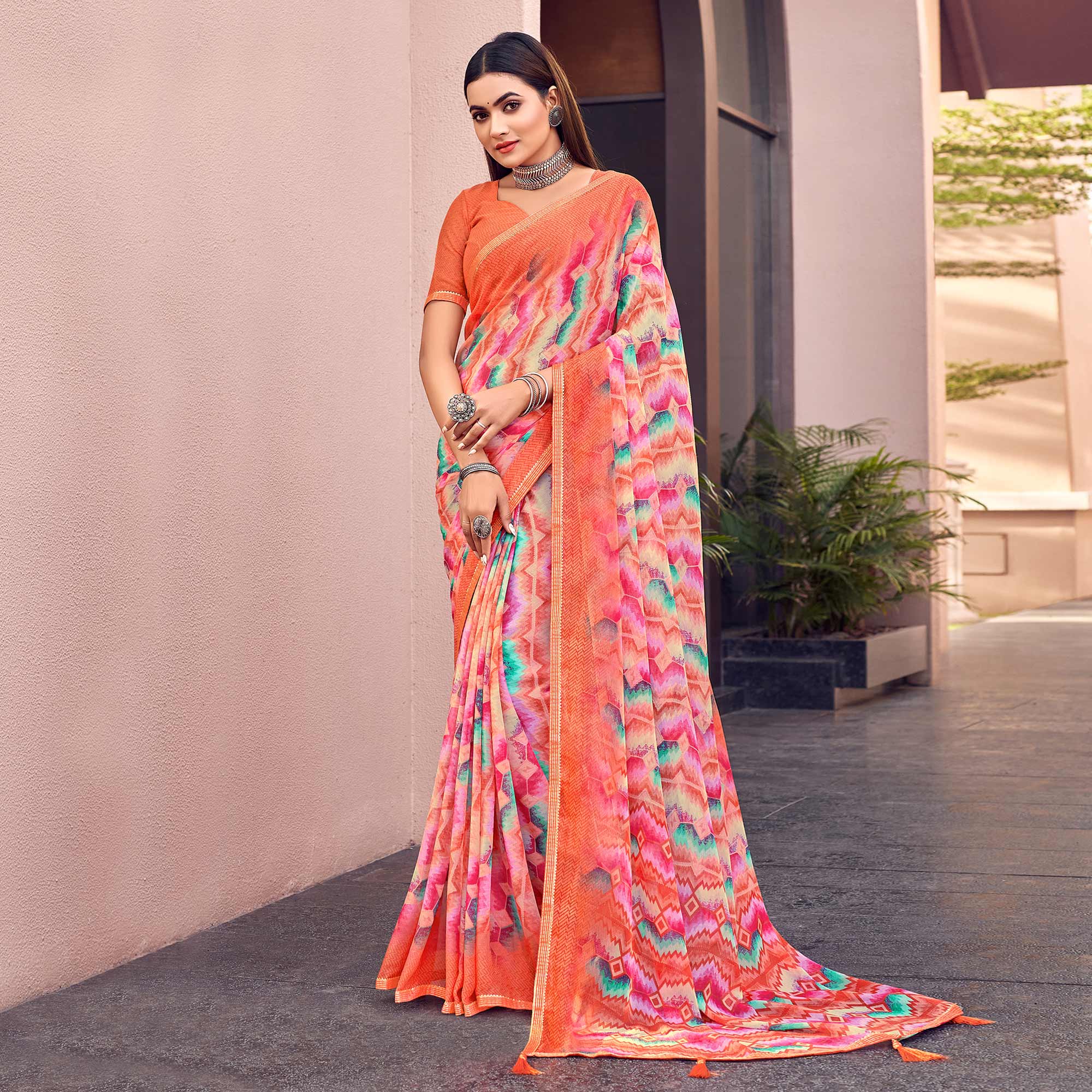 Orange Printed Chiffon Saree With Tassels