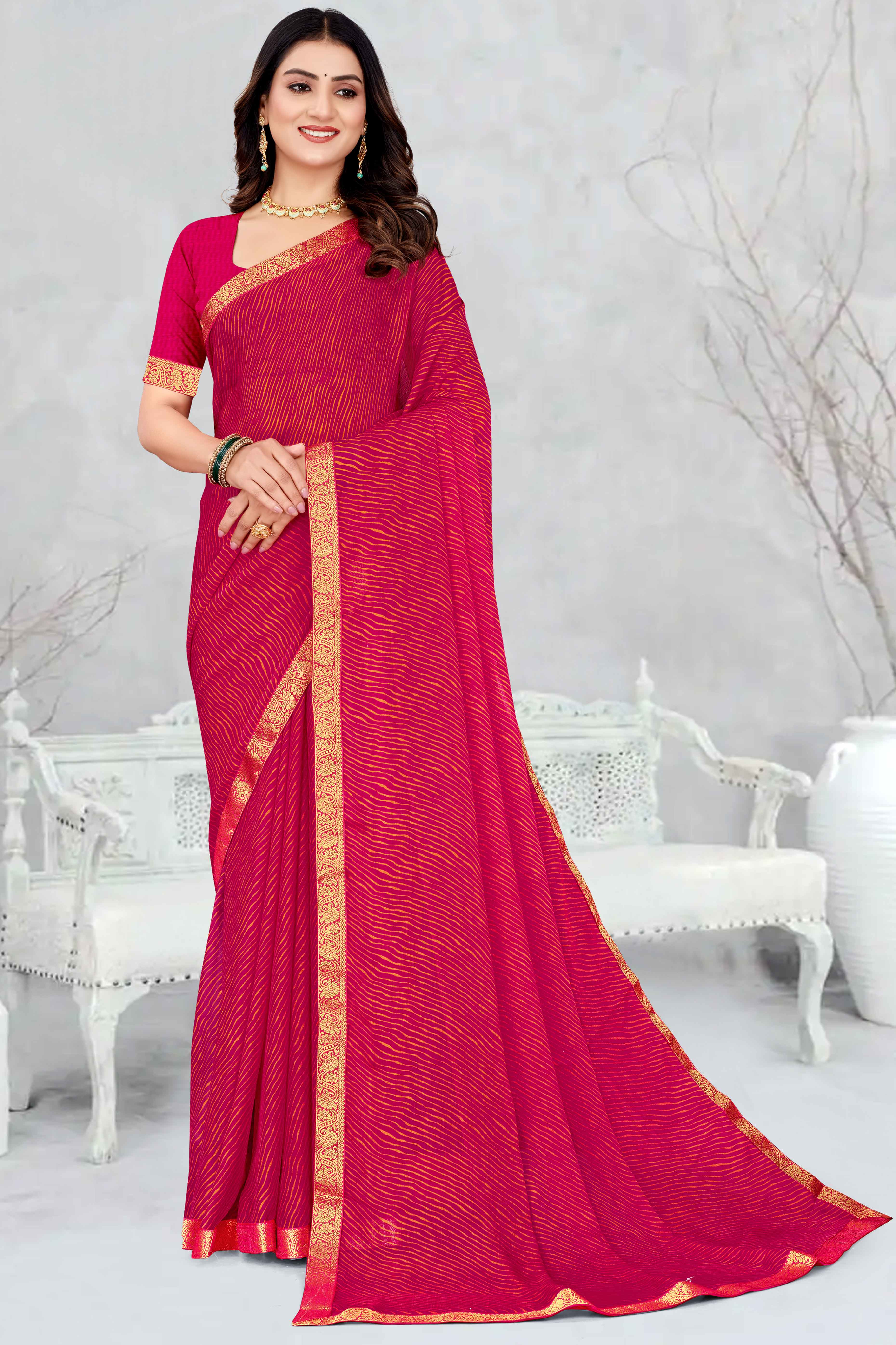 Pink Leheriya Printed Chiffon Saree Accented With A Graceful Floral Weaving Lace Border