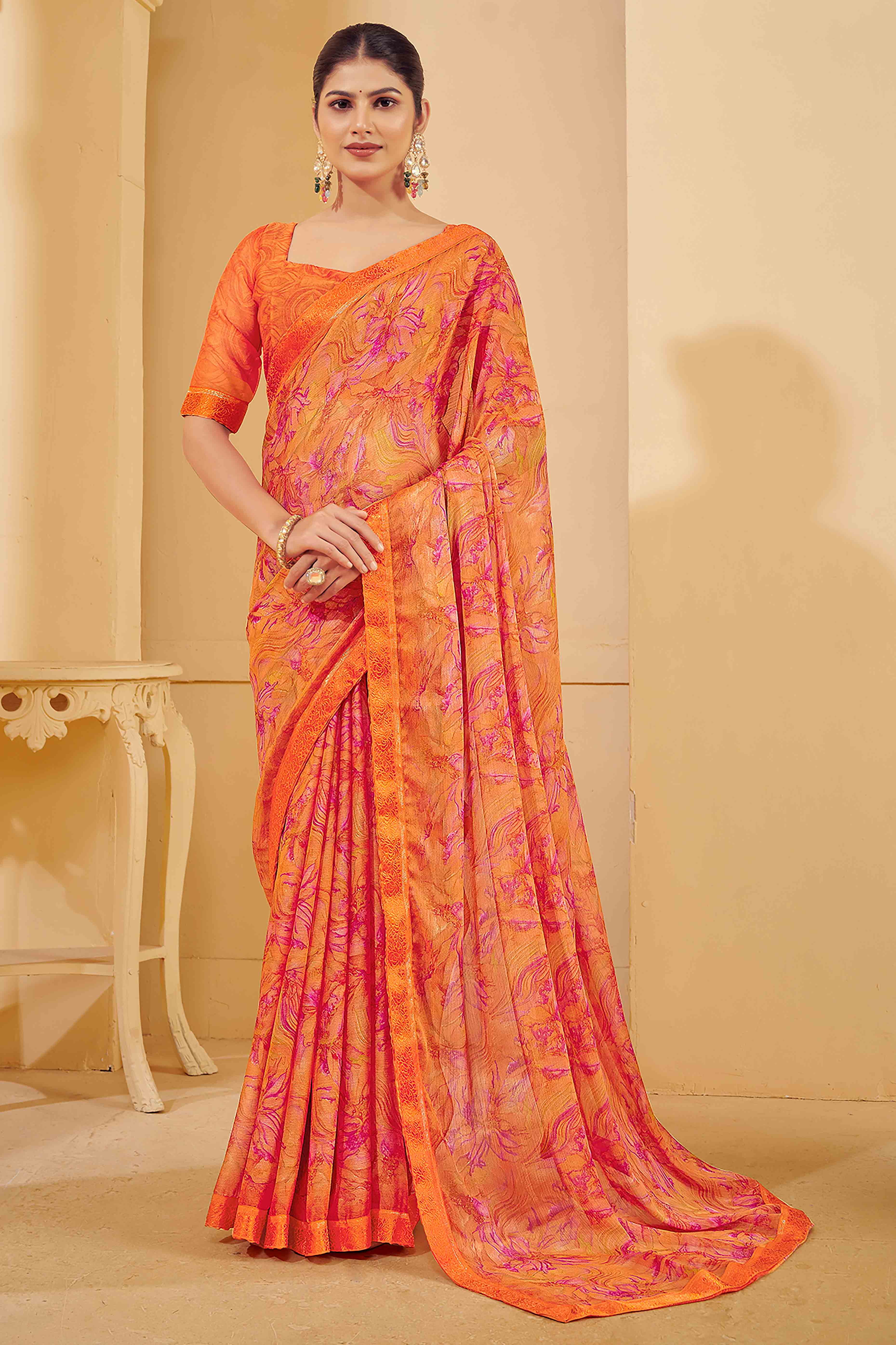 Orange Chiffon Saree Adorned With Artistic Floral Print & Finely Crafted Woven Lace Border