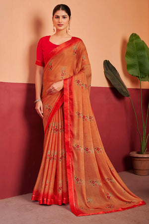 Orange Chiffon Saree Featuring Delicate Floral Prints & A Graceful Lace Border