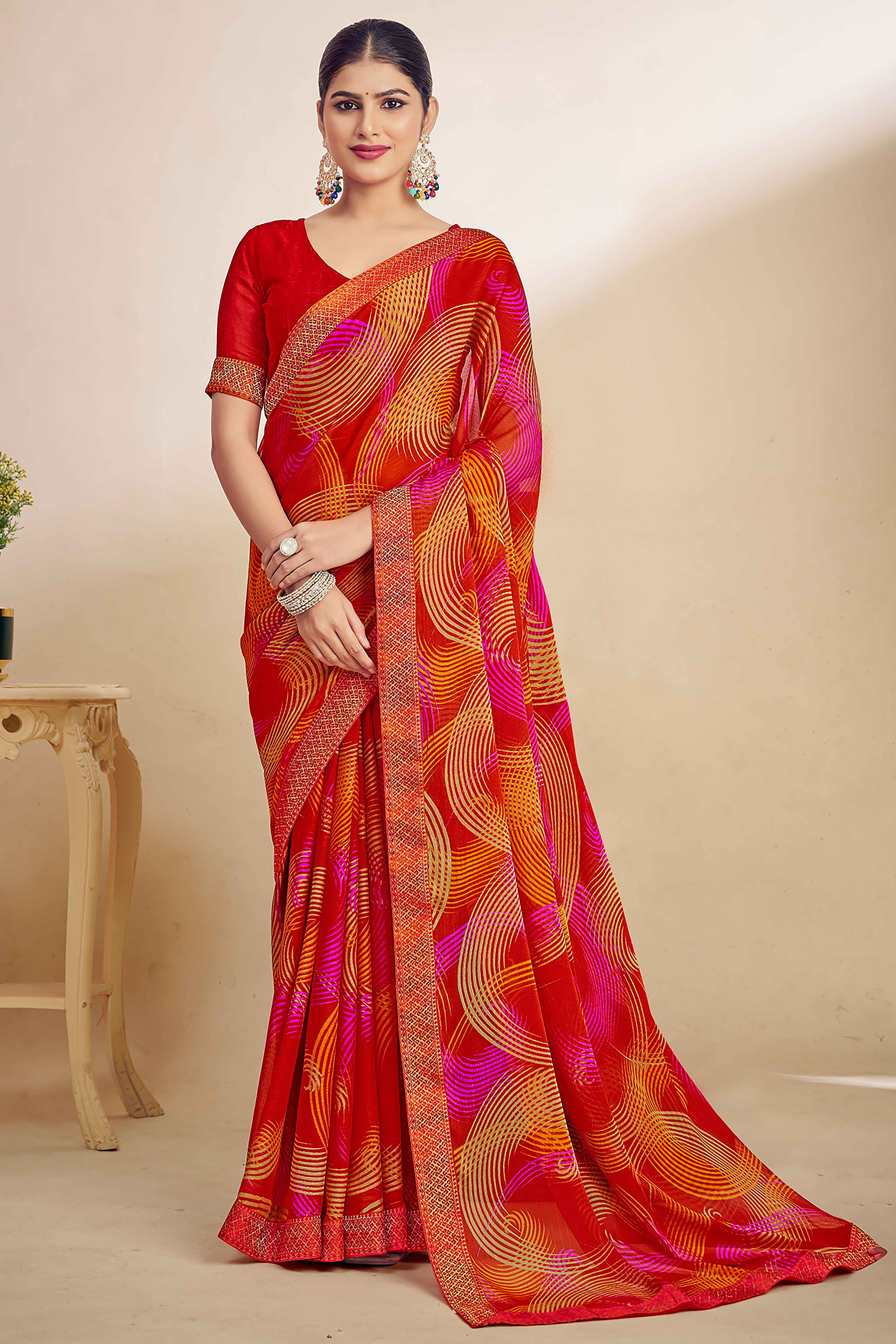 Red Chiffon Saree Adorned With Artistic Print & Finely Crafted Woven Lace Border