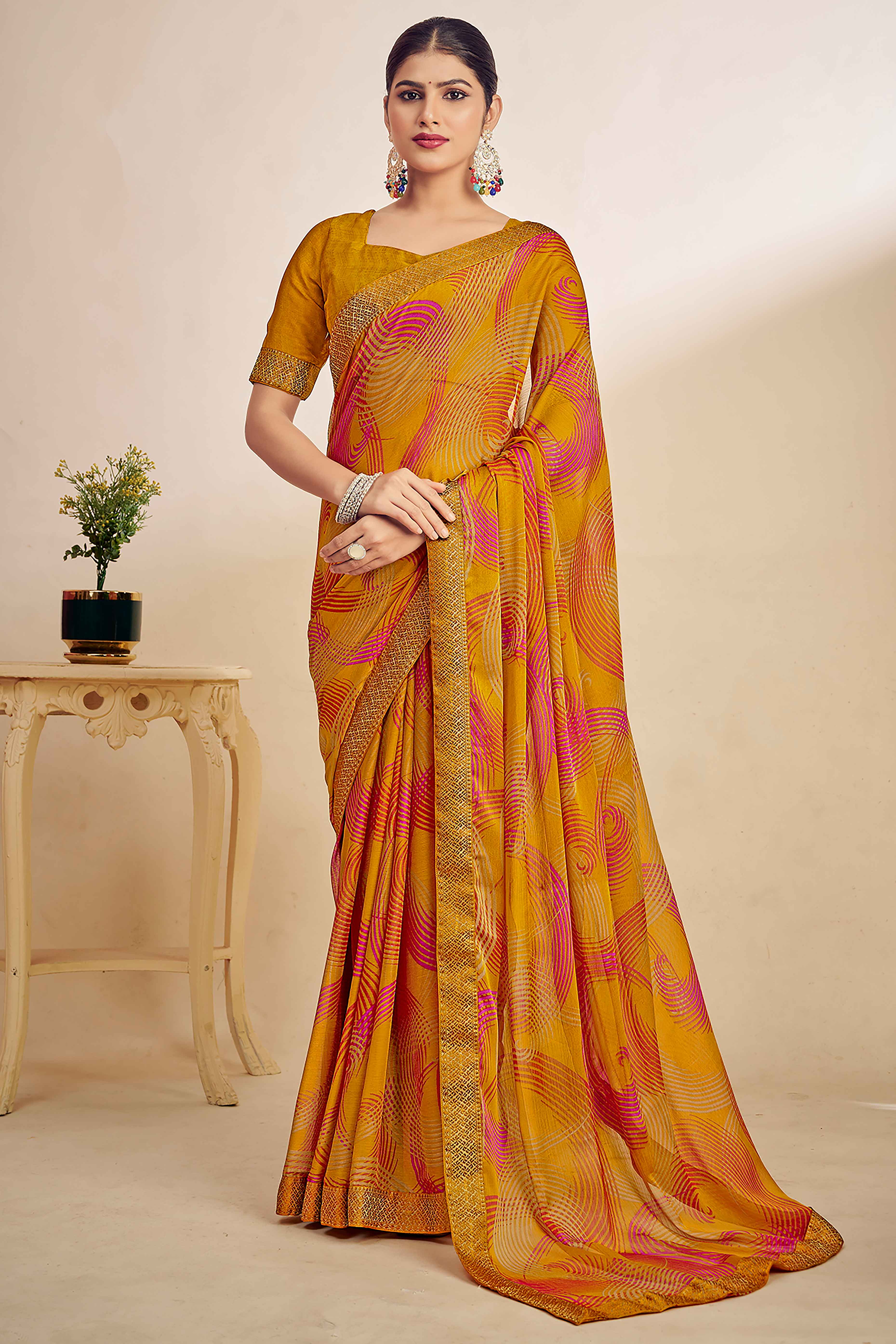 Mustard Chiffon Saree Adorned With Artistic Print & Finely Crafted Woven Lace Border