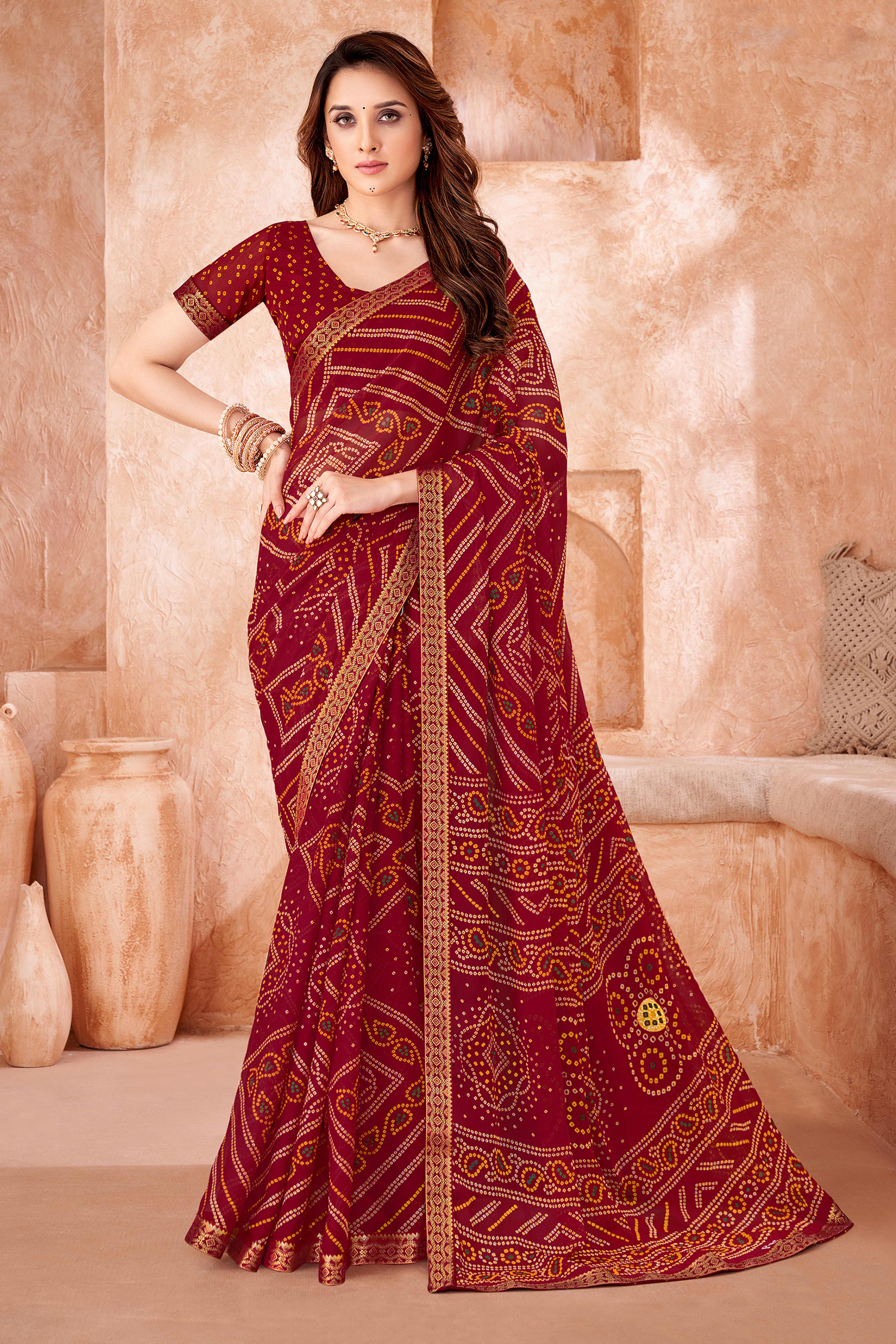 Maroon Chiffon Saree Featuring Traditional Bandhani Prints & A Graceful Lace Edge