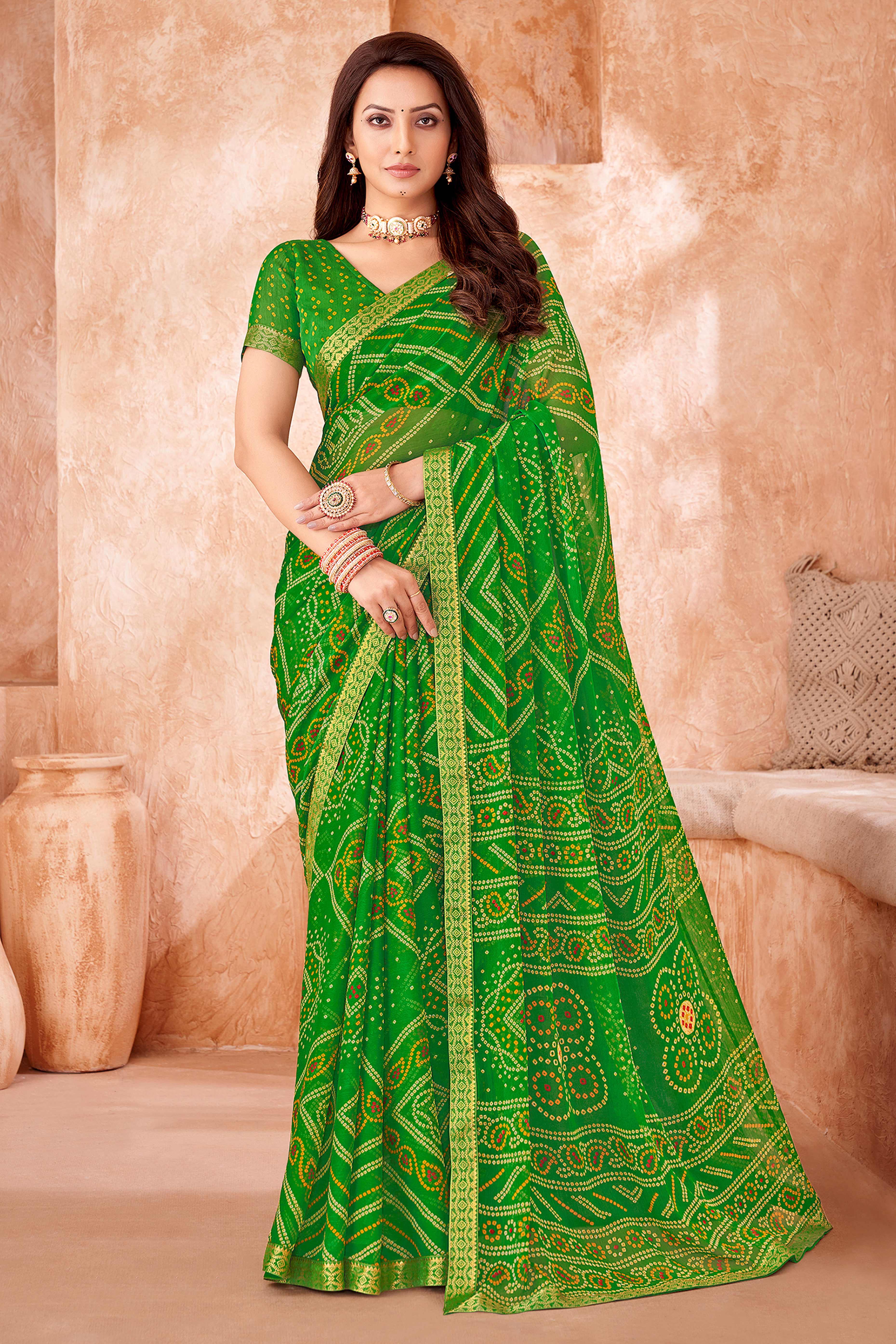 Green Chiffon Saree Featuring Traditional Bandhani Prints & A Graceful Lace Edge