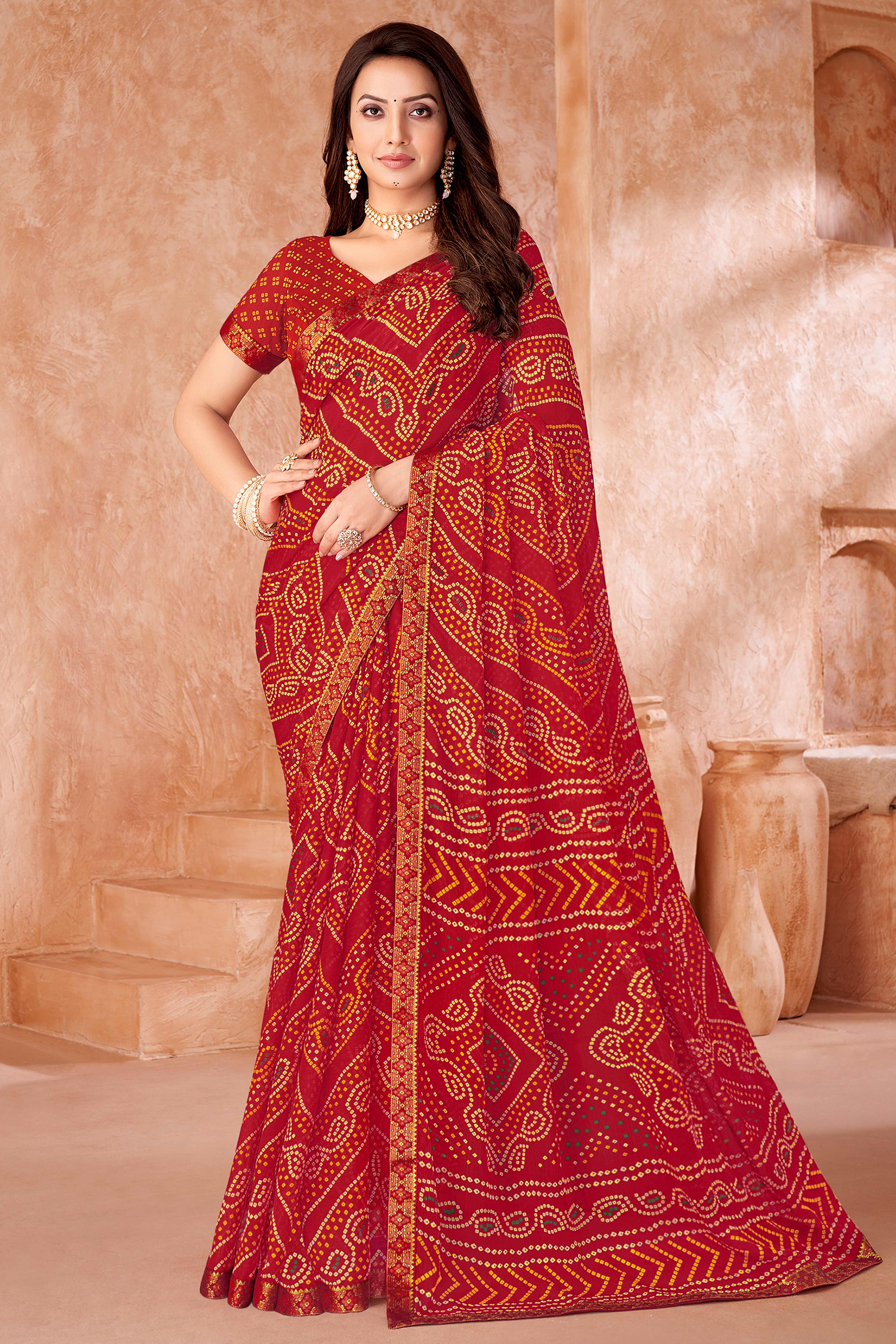 Red Chiffon Saree Featuring Traditional Bandhani Prints & A Graceful Lace Edge