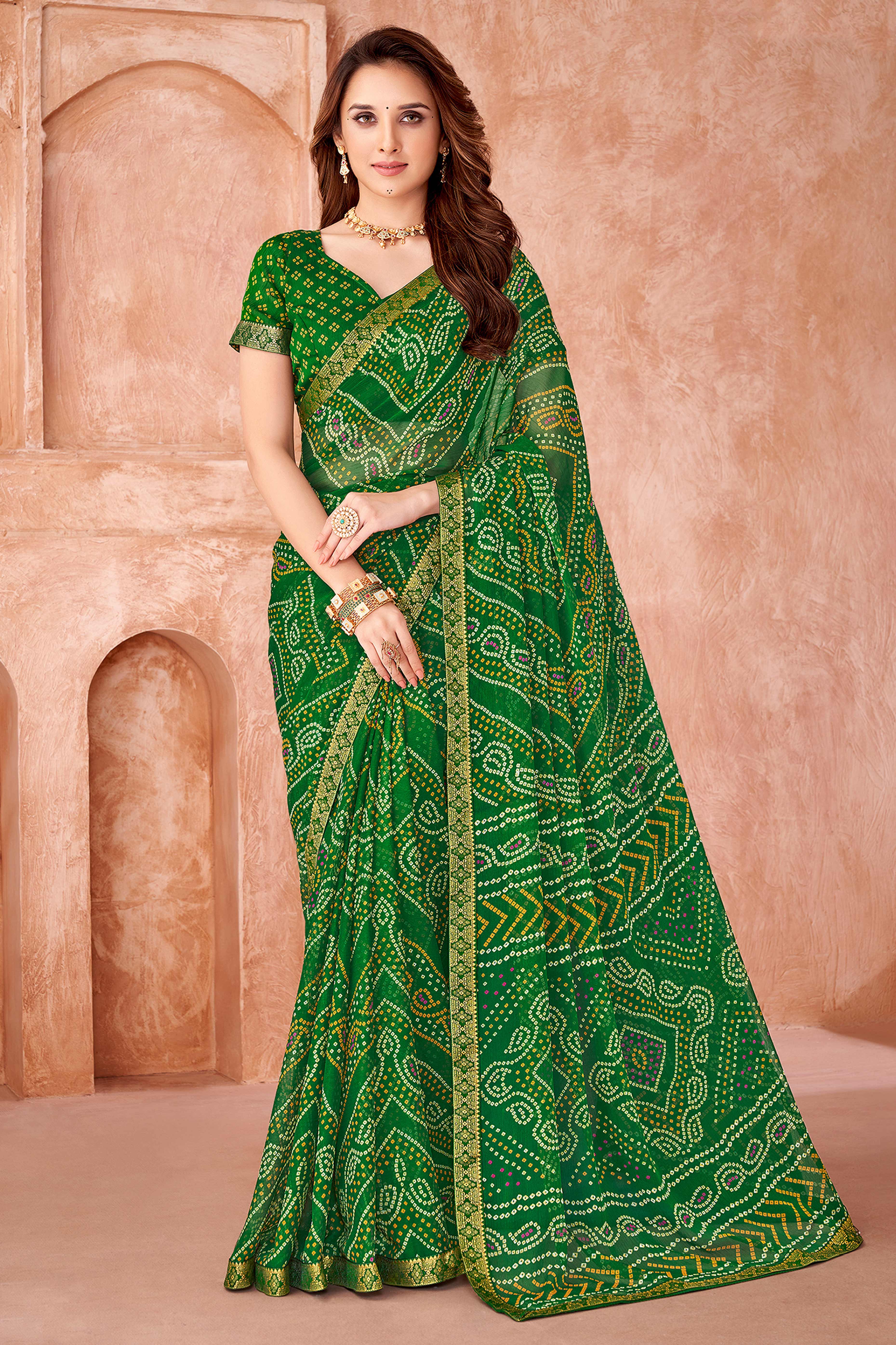 Green Chiffon Saree Featuring Traditional Bandhani Prints & A Graceful Lace Edge