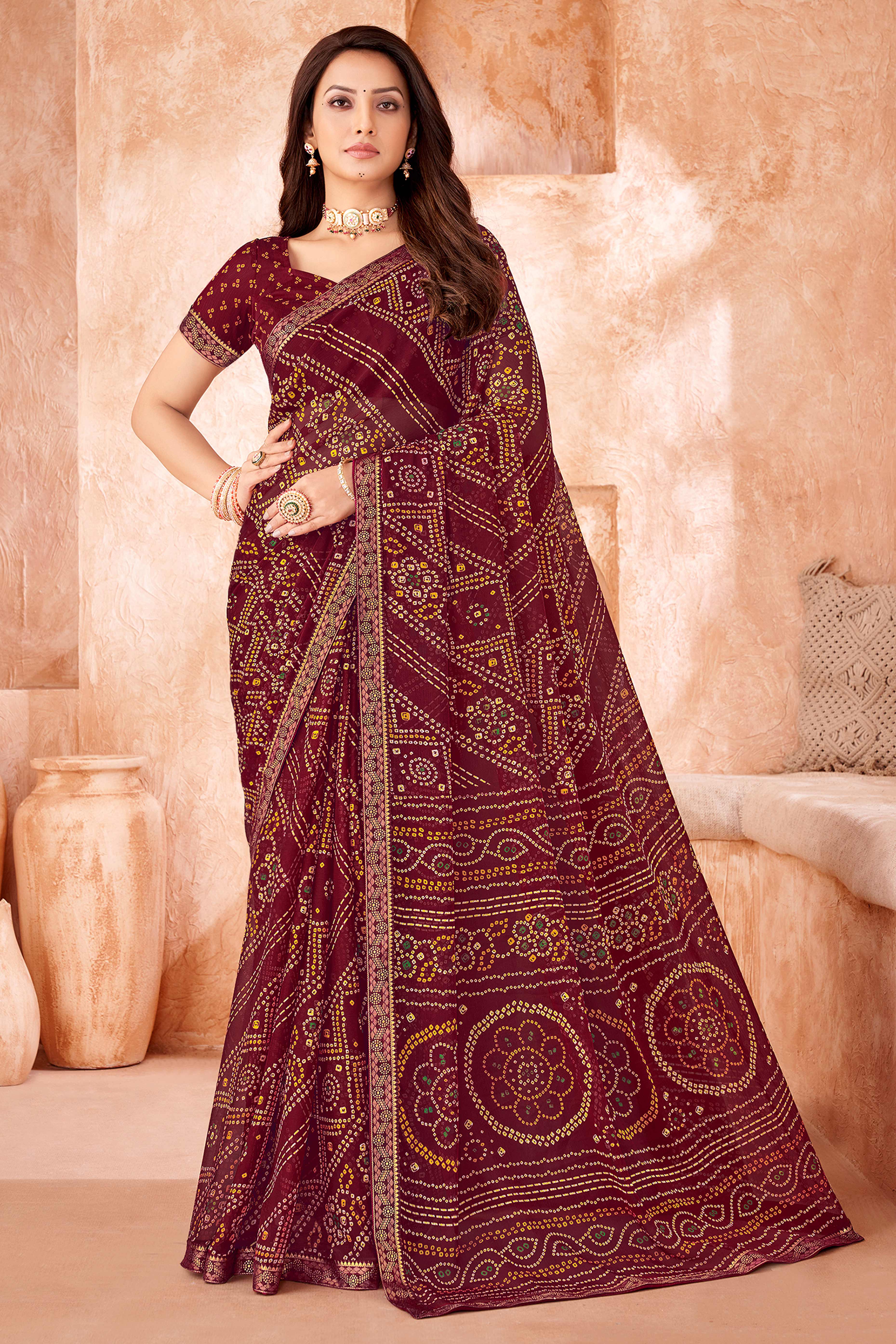 Maroon Chiffon Saree Featuring Traditional Bandhani Prints & A Graceful Lace Edge