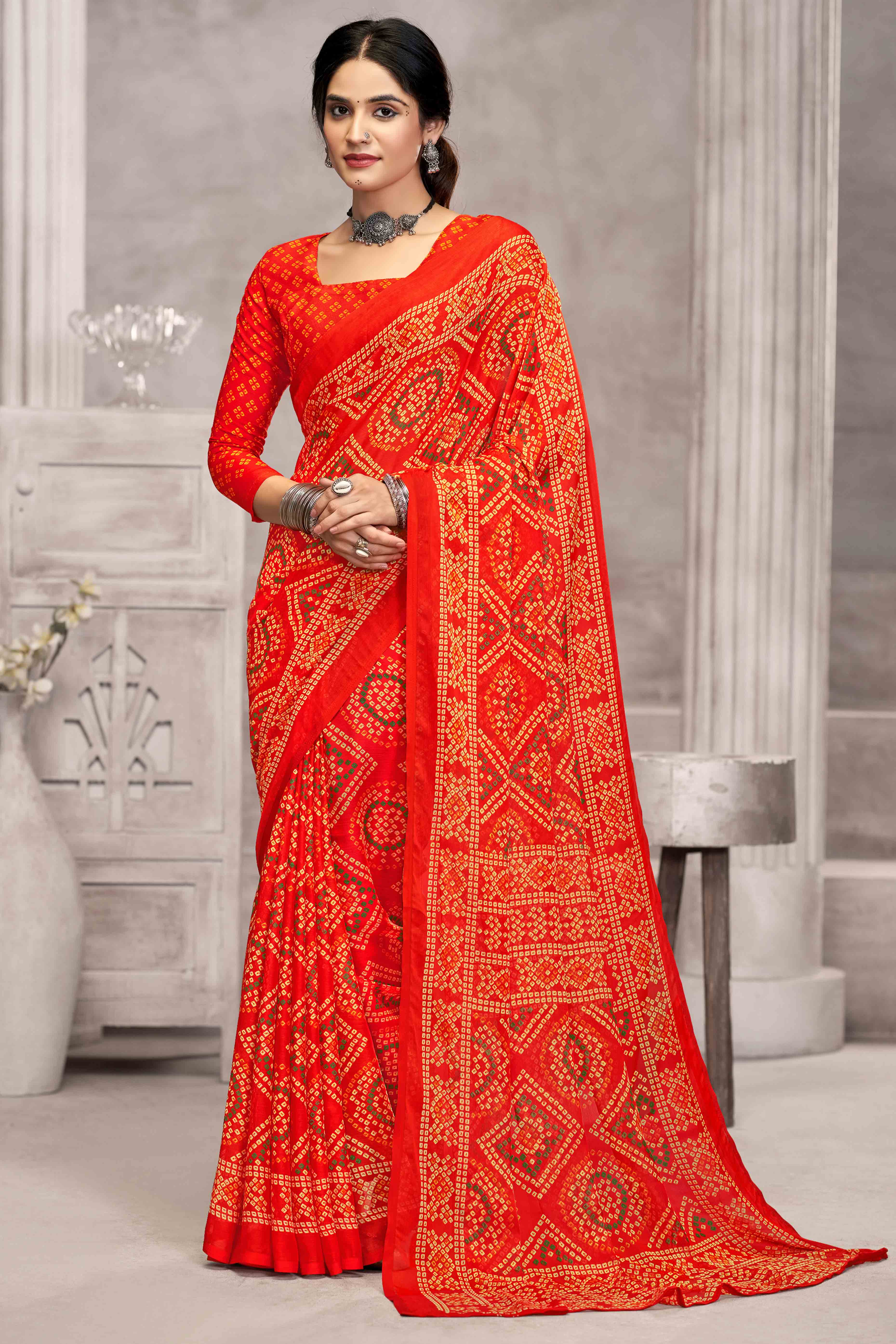 Orange Chiffon Saree Features Bandhani Print for Casual Occasion