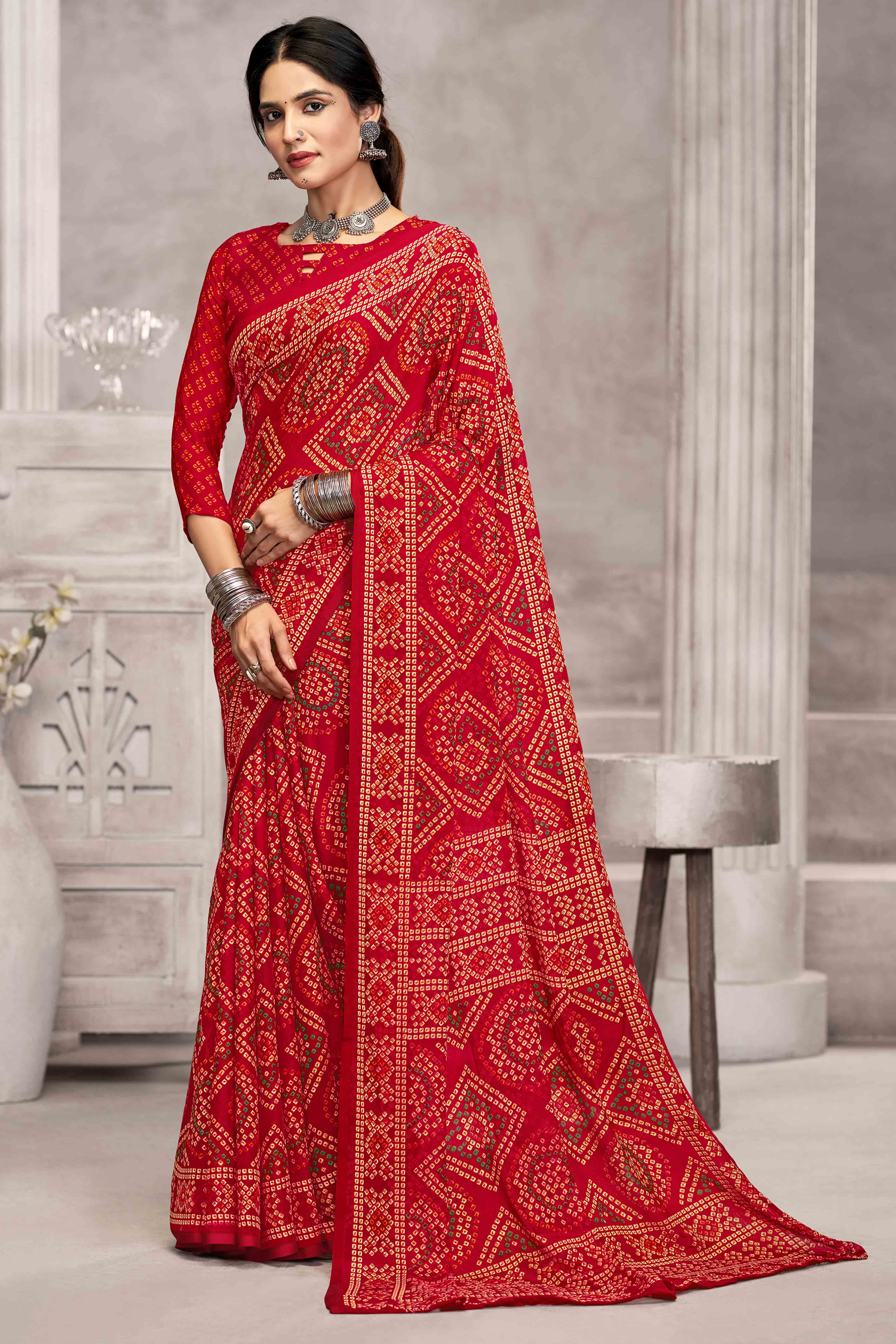 Red Chiffon Saree Features Bandhani Print for Casual Occasion