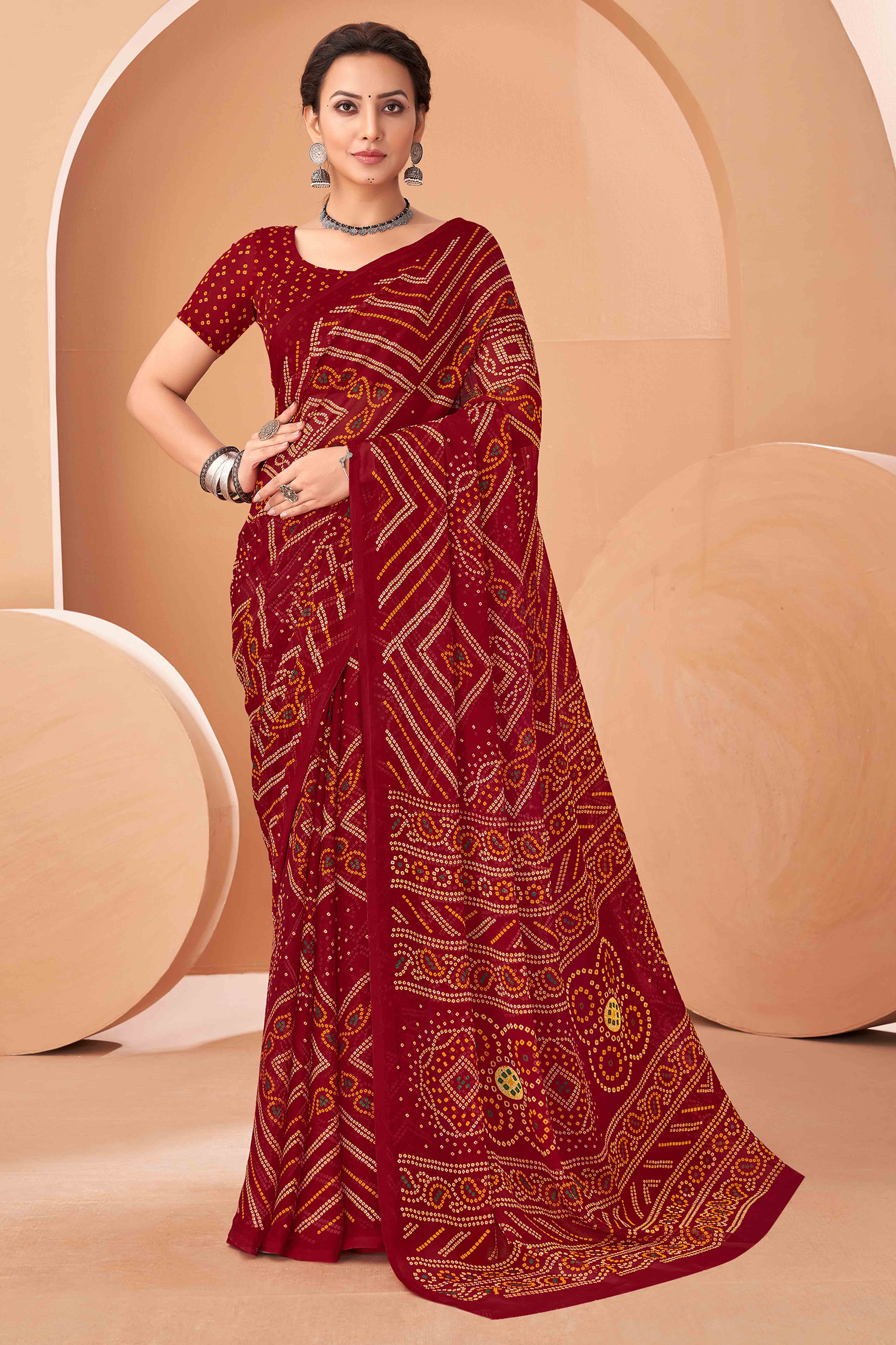 Maroon Bandhani Printed Chiffon Saree Accented With Intricate Lace Border Work