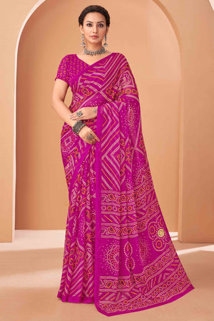 Magenta Bandhani Printed Chiffon Saree Accented With Intricate Lace Border Work