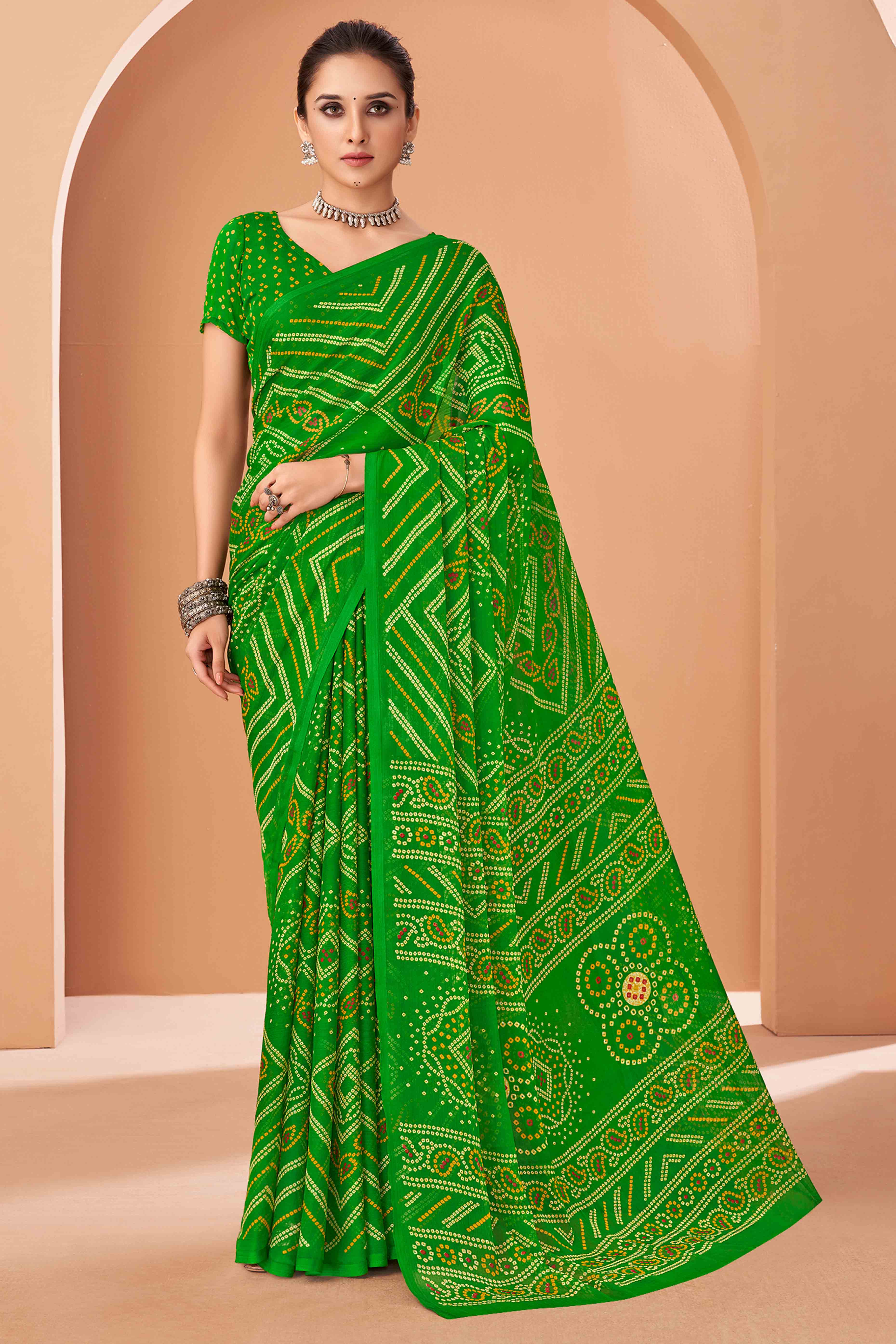 Green Bandhani Printed Chiffon Saree Accented With Intricate Lace Border Work
