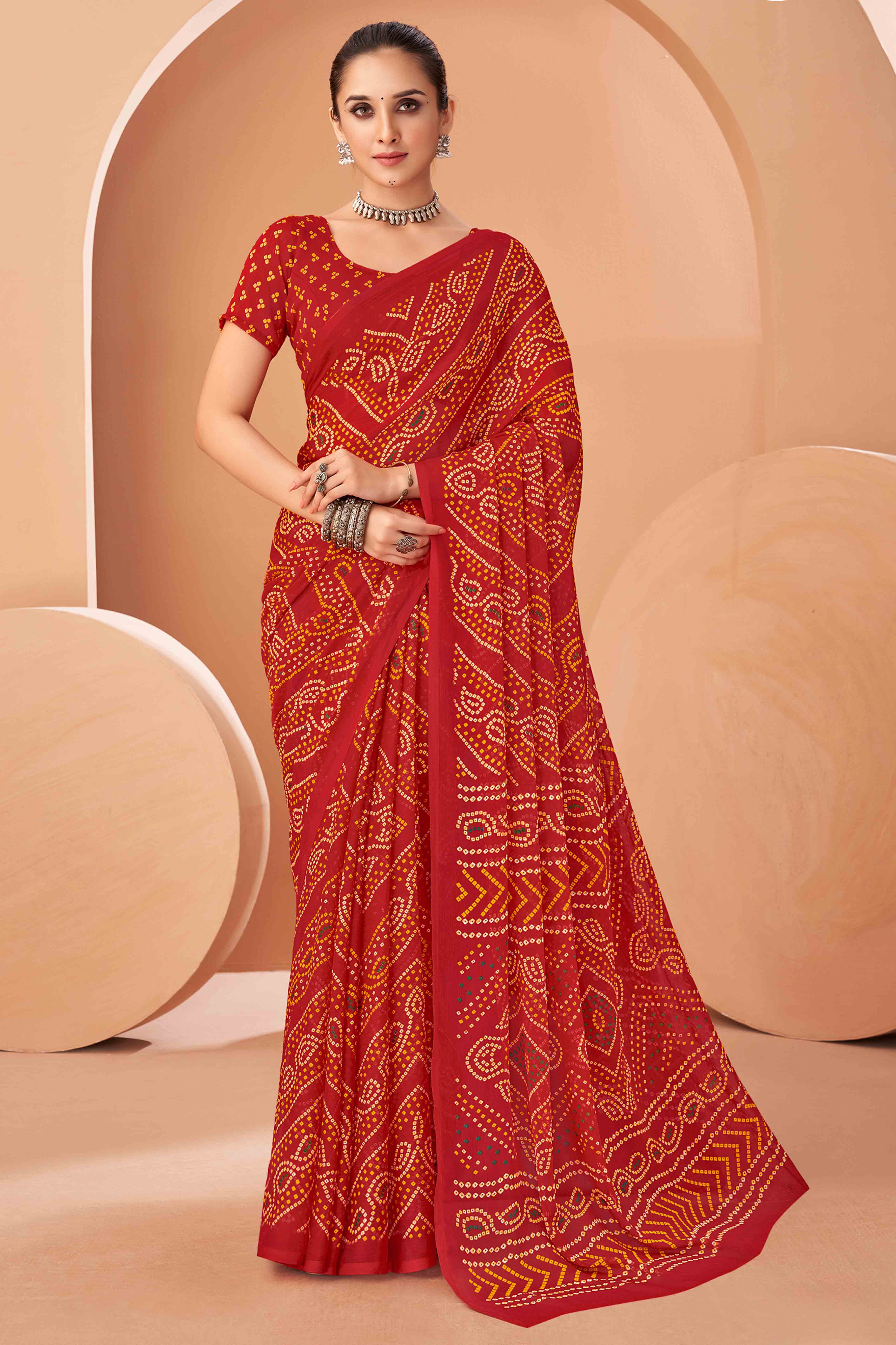Red Bandhani Printed Chiffon Saree Accented With Intricate Lace Border Work