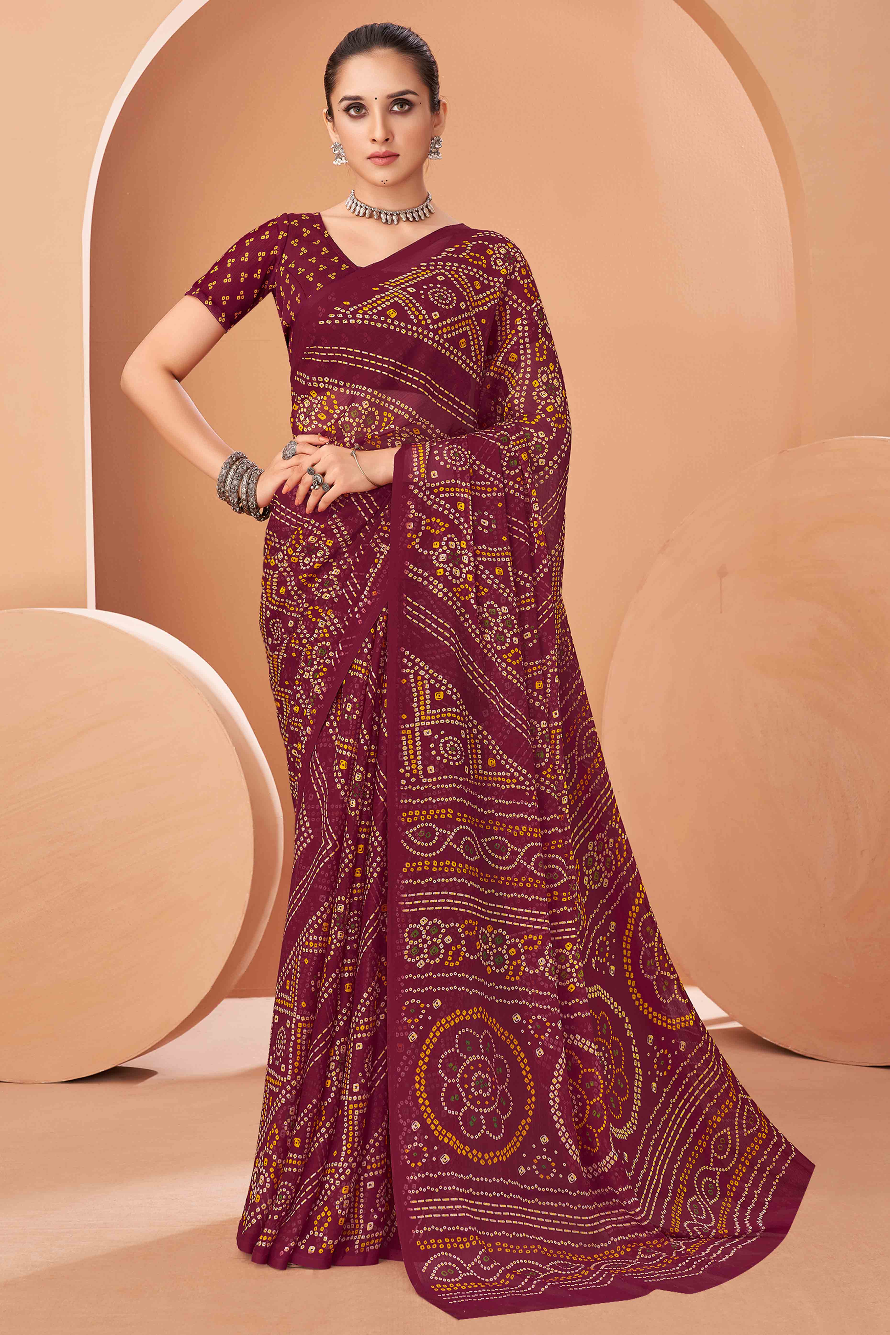 Maroon Bandhani Printed Chiffon Saree Accented With Intricate Lace Border Work