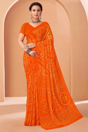 Orange Bandhani Printed Chiffon Saree Accented With Intricate Lace Border Work