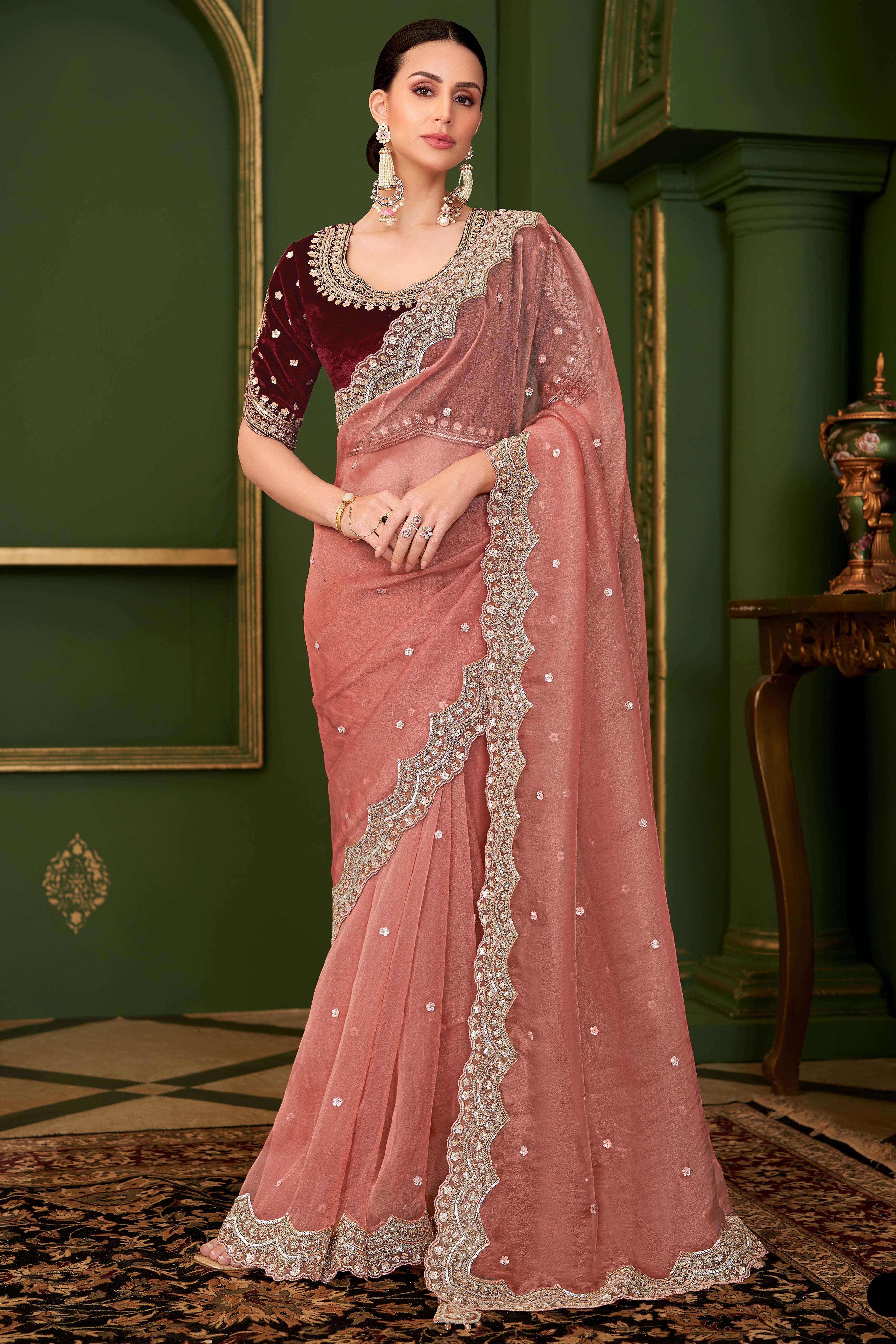Charming Peach Georgette Saree Adorned With Floral Cording Sequins Embroidery & Cutwork Border