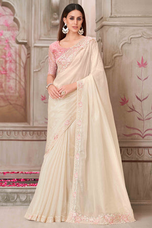 Glamorous Off White Satin Saree with Intricate Sequin & Floral Work
