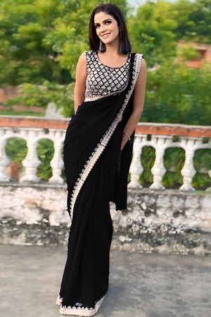 Black Georgette Saree With Sleek Solid Finish And Embroidered Edging