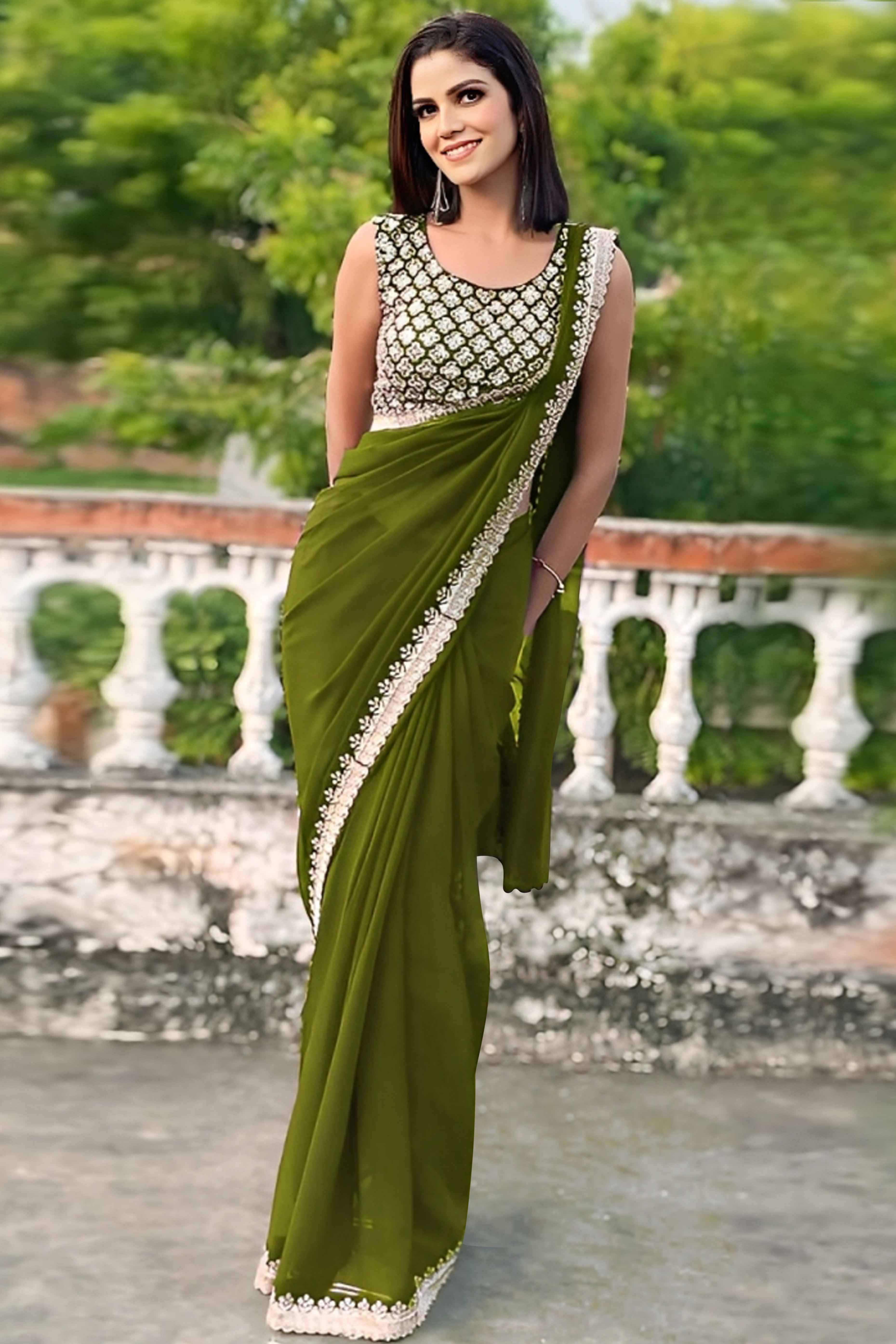 Green Georgette Saree With Sleek Solid Finish And Embroidered Edging