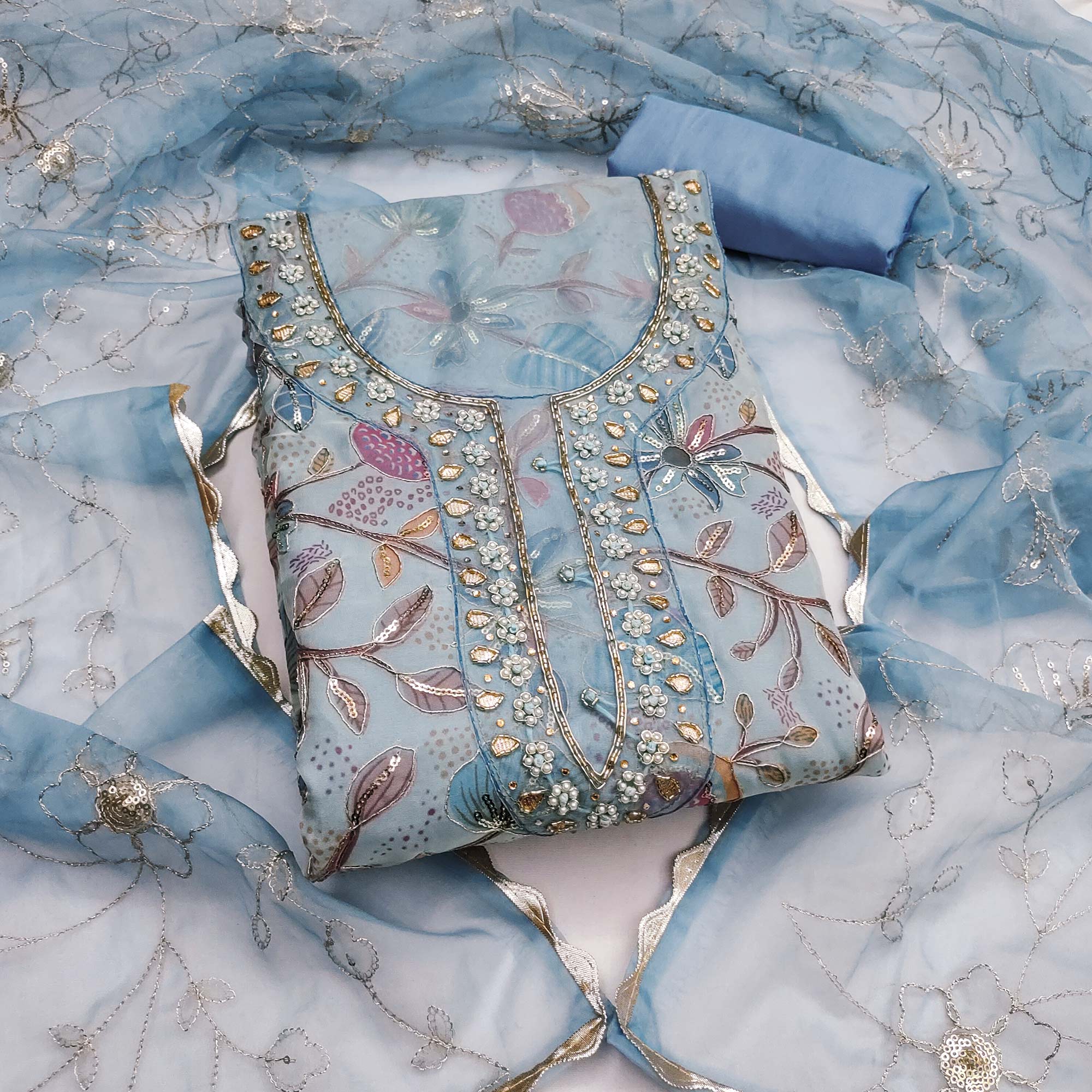 Blue Floral Elegance Dress Material With Handwork & Sequins On Organza Blue Floral Elegance Dress Material With Handwork & Sequins On Organza
