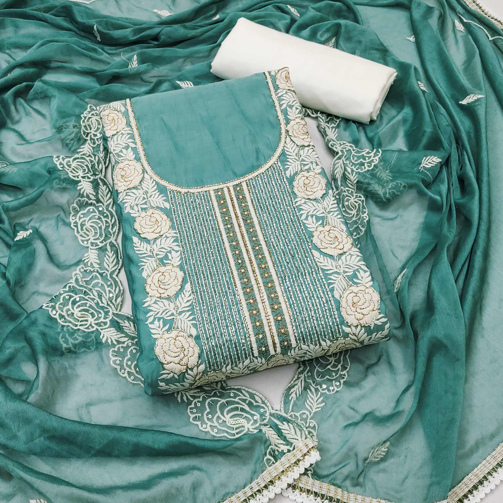 Teal Cotton Silk Dress Material Embellished With Floral Embroidery & Intricate Handwork