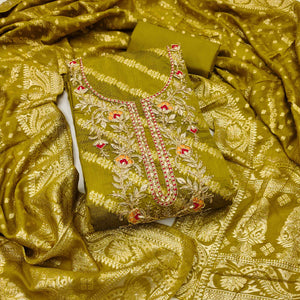 Green Shimmer Cotton Silk Suit Material Featuring Zari Weaving and Artistic Embroidered Detailing
