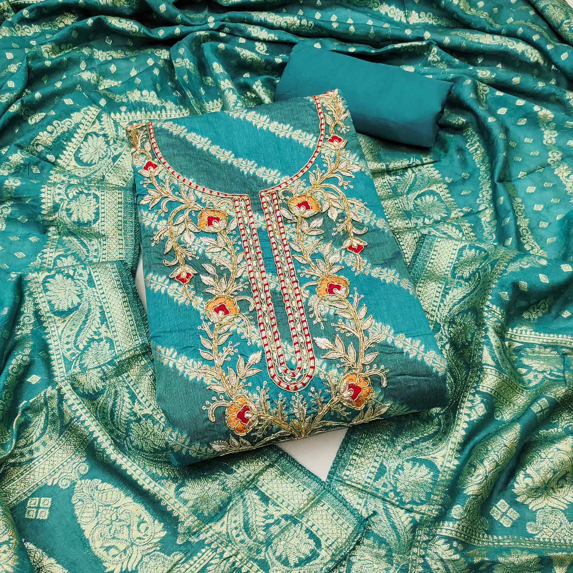 Rama Green Shimmer Cotton Silk Suit Material Featuring Zari Weaving and Artistic Embroidered Detailing
