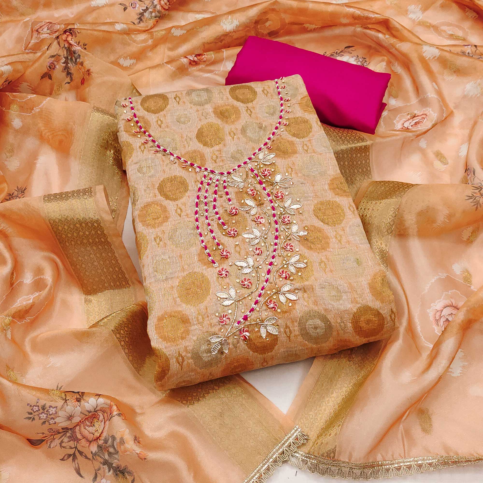 Sophisticated Light Peach Zari Woven Jacquard Dress Material Highlighted With Floral Handwork