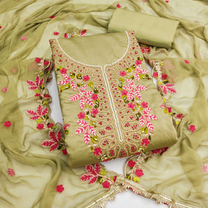 Charming Green Floral Embroidery Cotton Silk Dress Material Enhanced With Elegant Moti Handwork