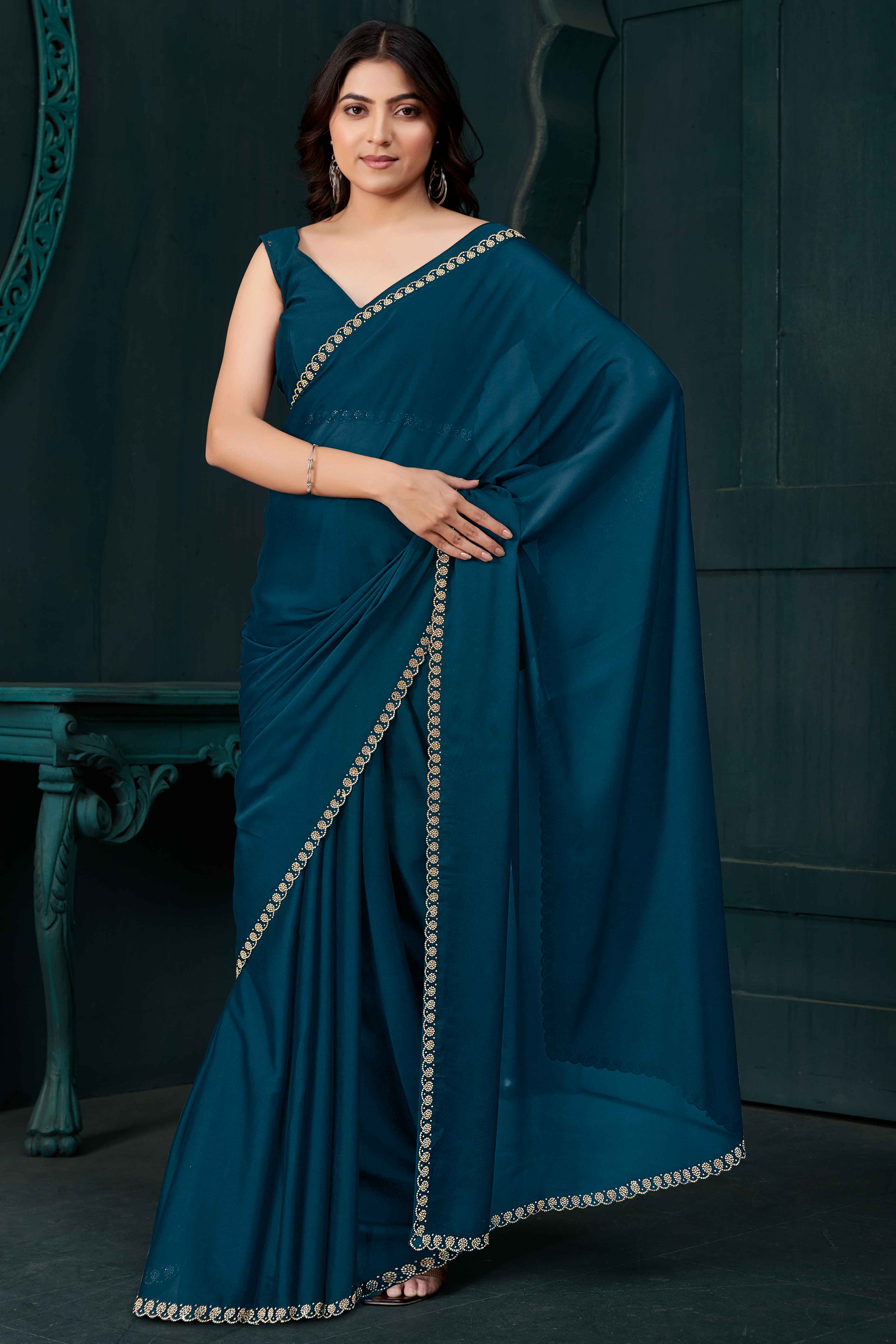 Petrol Blue Crepe Silk Solid Saree with Elegant Zarkan Border Detailing