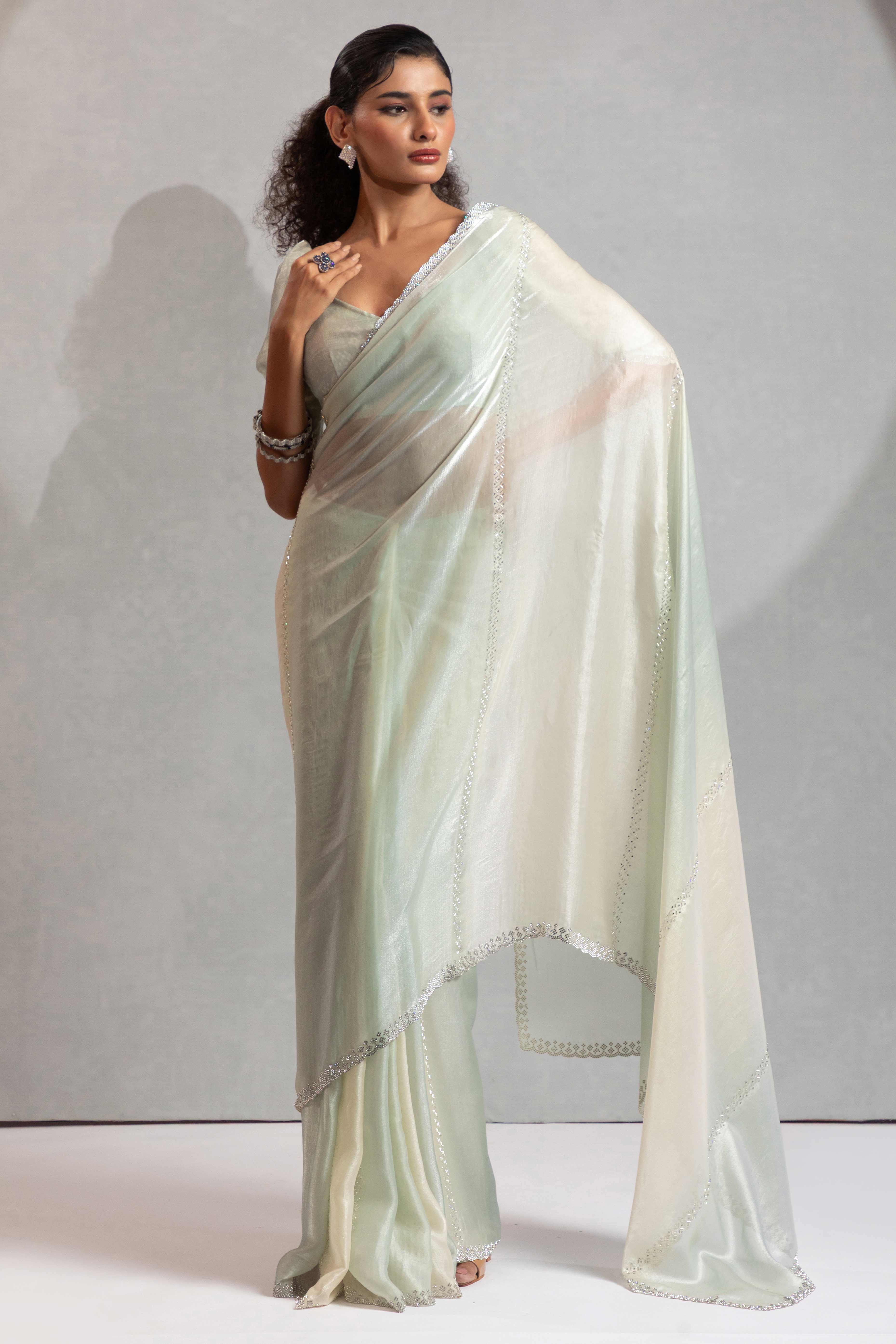 Celadon Green & Off White Satin Silk Saree Decorated With Stone Embellishments