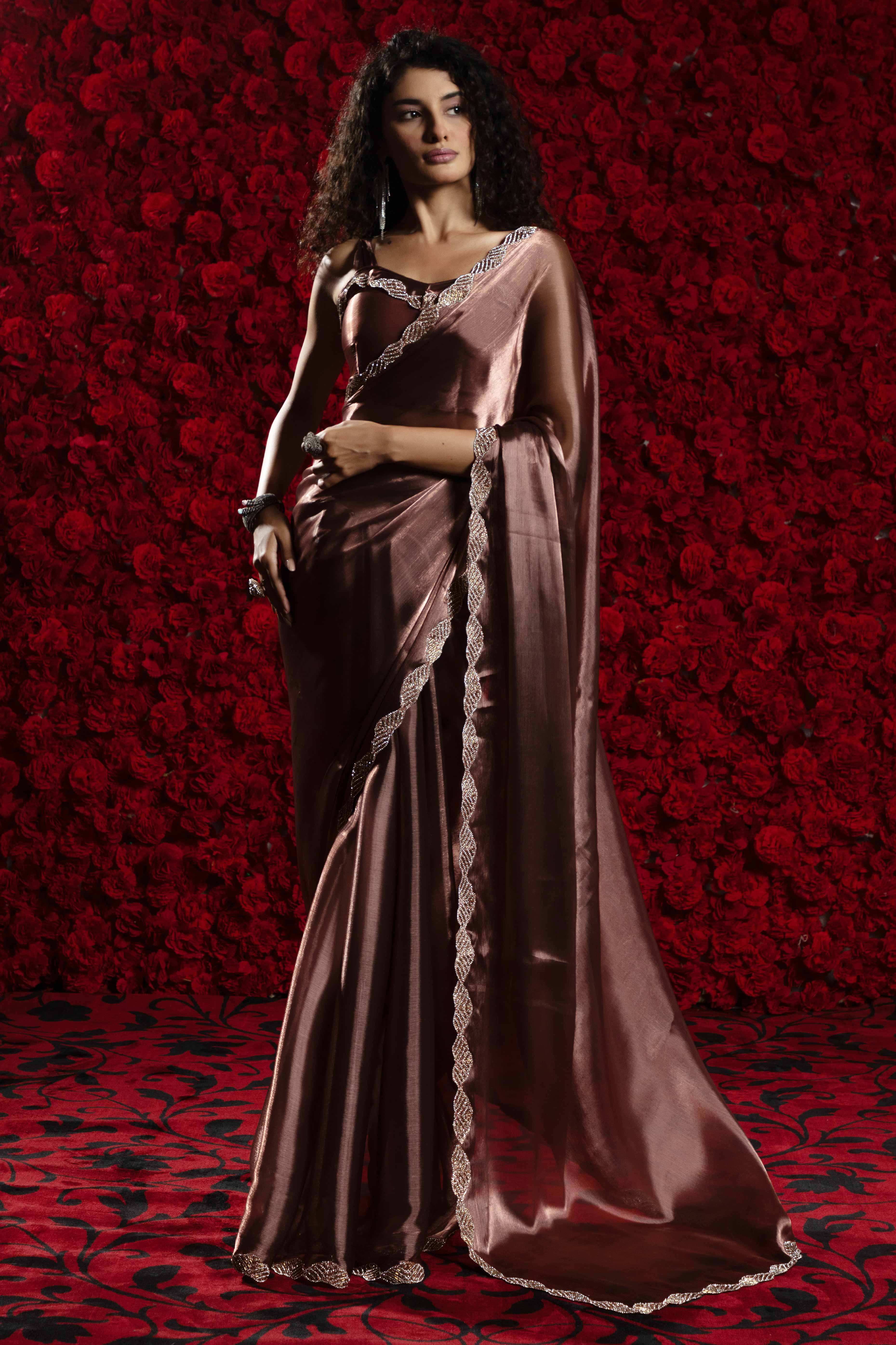 Brown Solid Tissue Chiffon Saree Accentuated With A Sparkling Zarkan Work Border