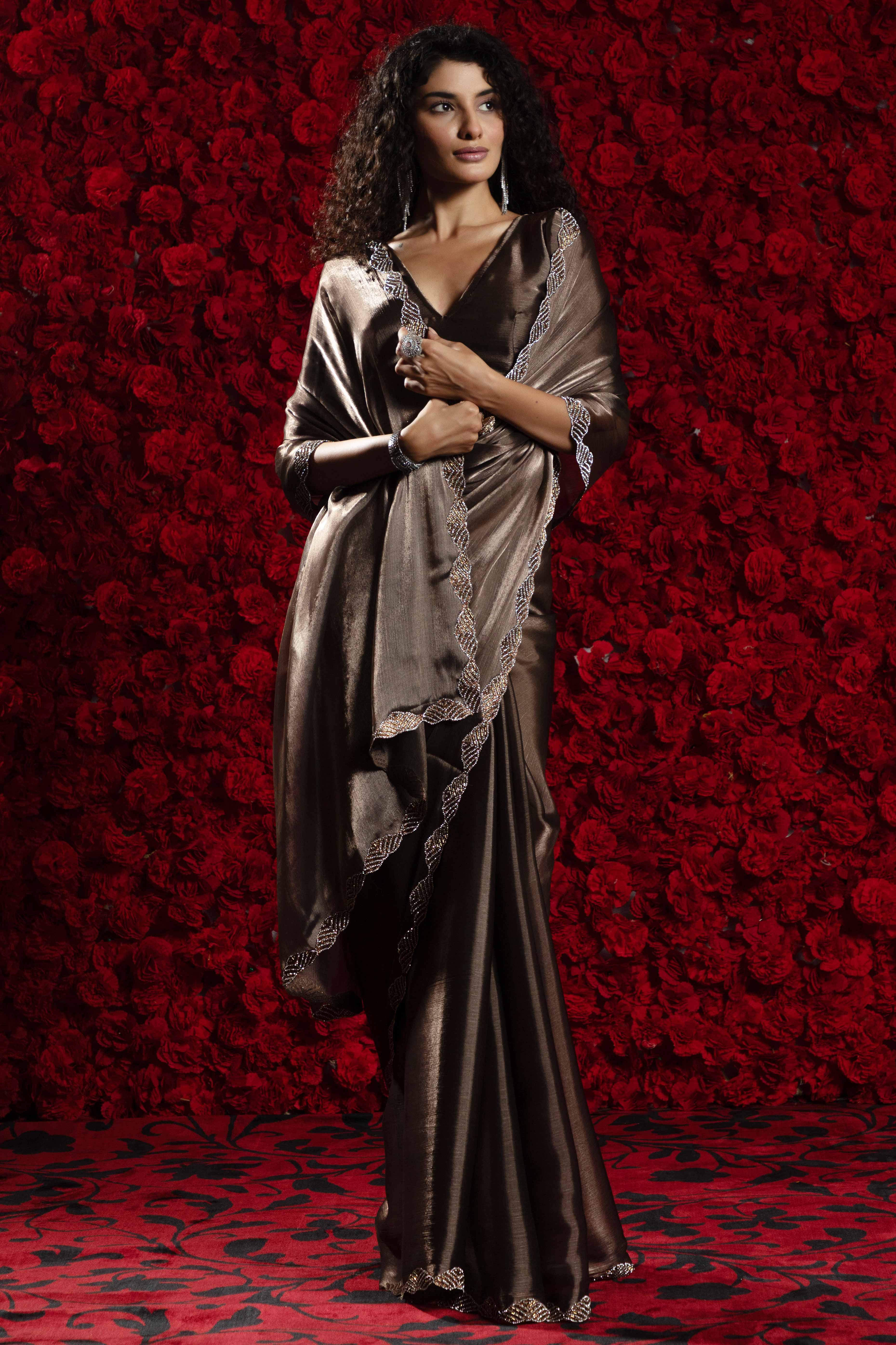 Dark Brown Solid Tissue Chiffon Saree Accentuated With A Sparkling Zarkan Work Border