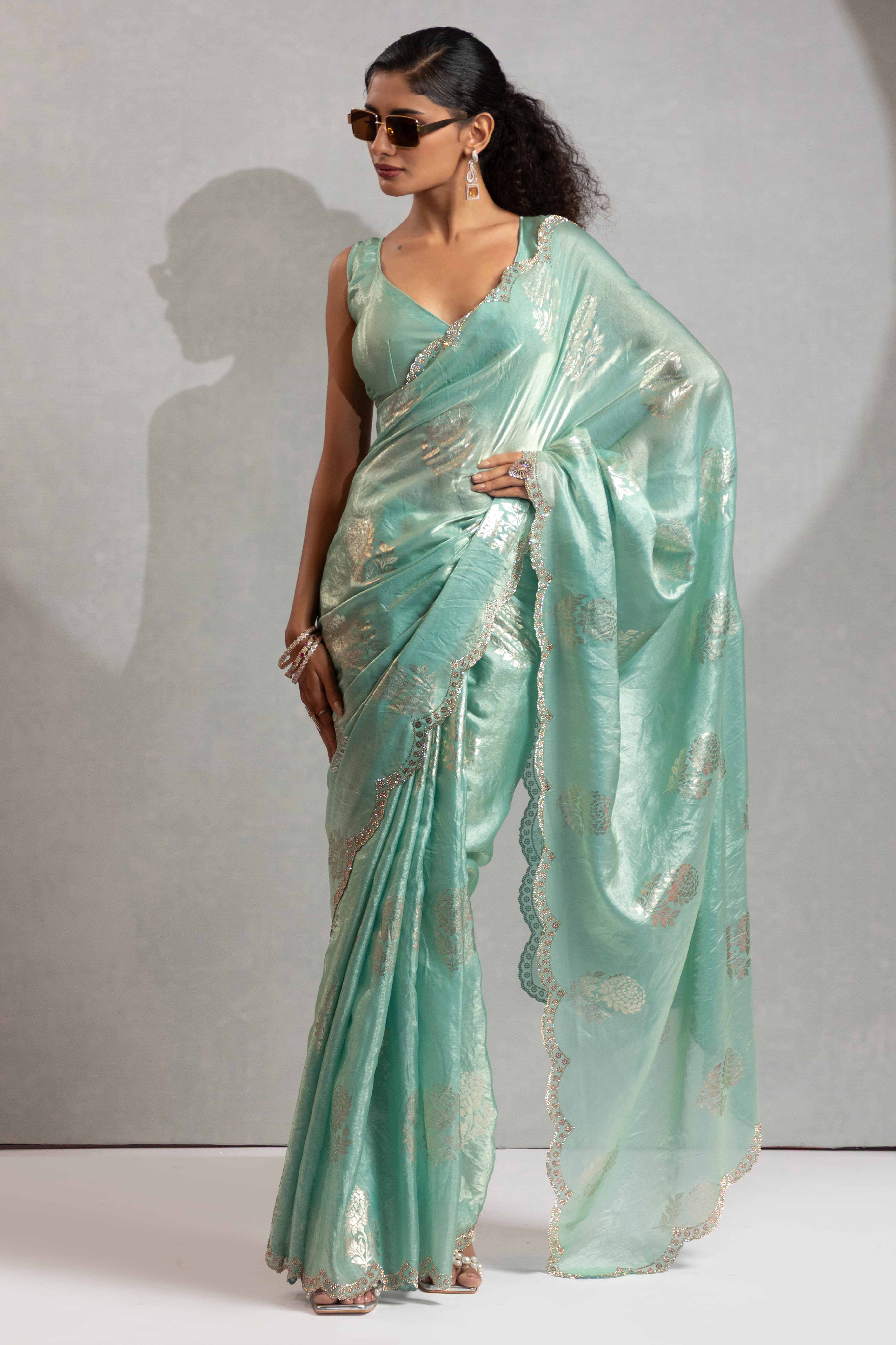 Turquoise Satin Silk Saree Showcasing Elegant Floral Foil Prints & Dazzling Zarkan Work