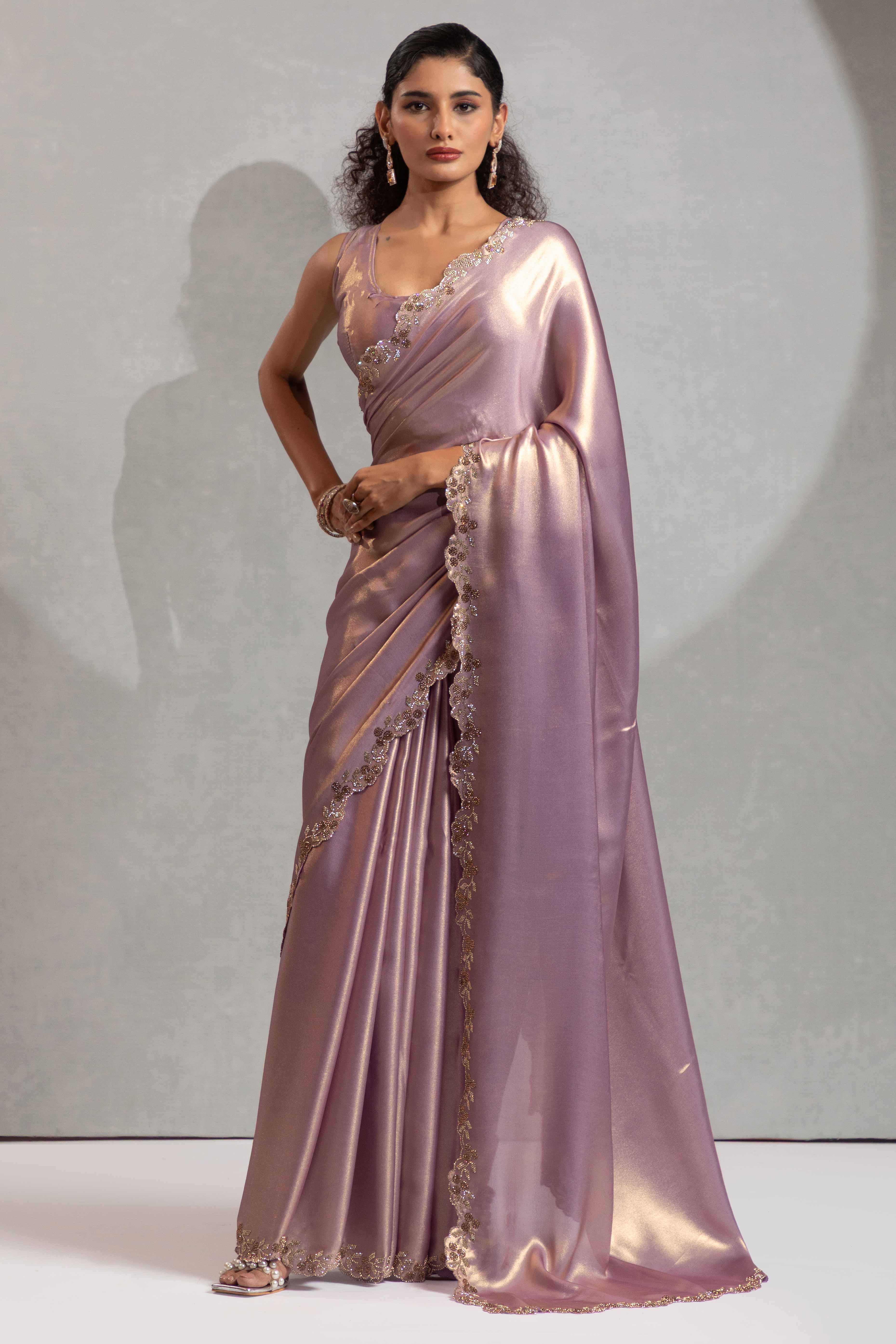 Lavender Satin Georgette Saree Adorned With Subtle Foil Finish & A Sparkling Zarkan Work Border