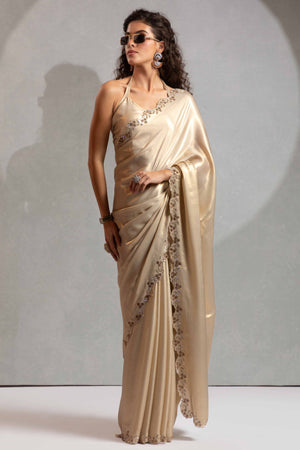 Beige Satin Georgette Saree Adorned With Subtle Foil Finish & A Sparkling Zarkan Work Border