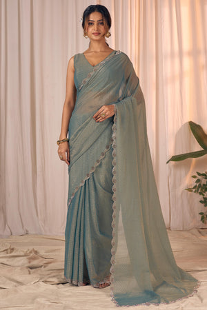 Designer Sage Green Georgette Saree Adorned With An Elegant Zarkan Cutwork Border