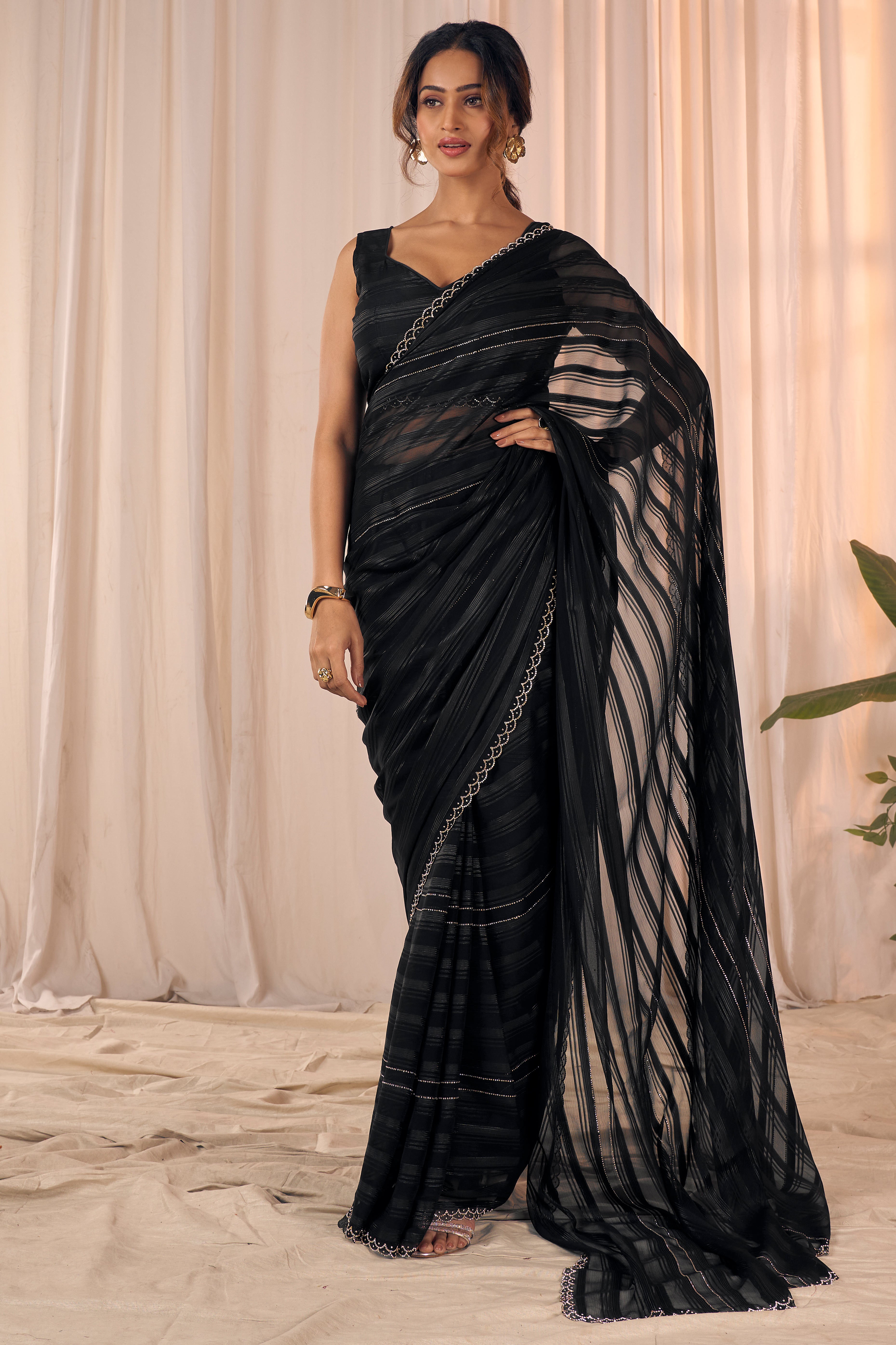 Black Striped Designer Georgette Saree Adorned With An Elegant Zarkan Cutwork Border