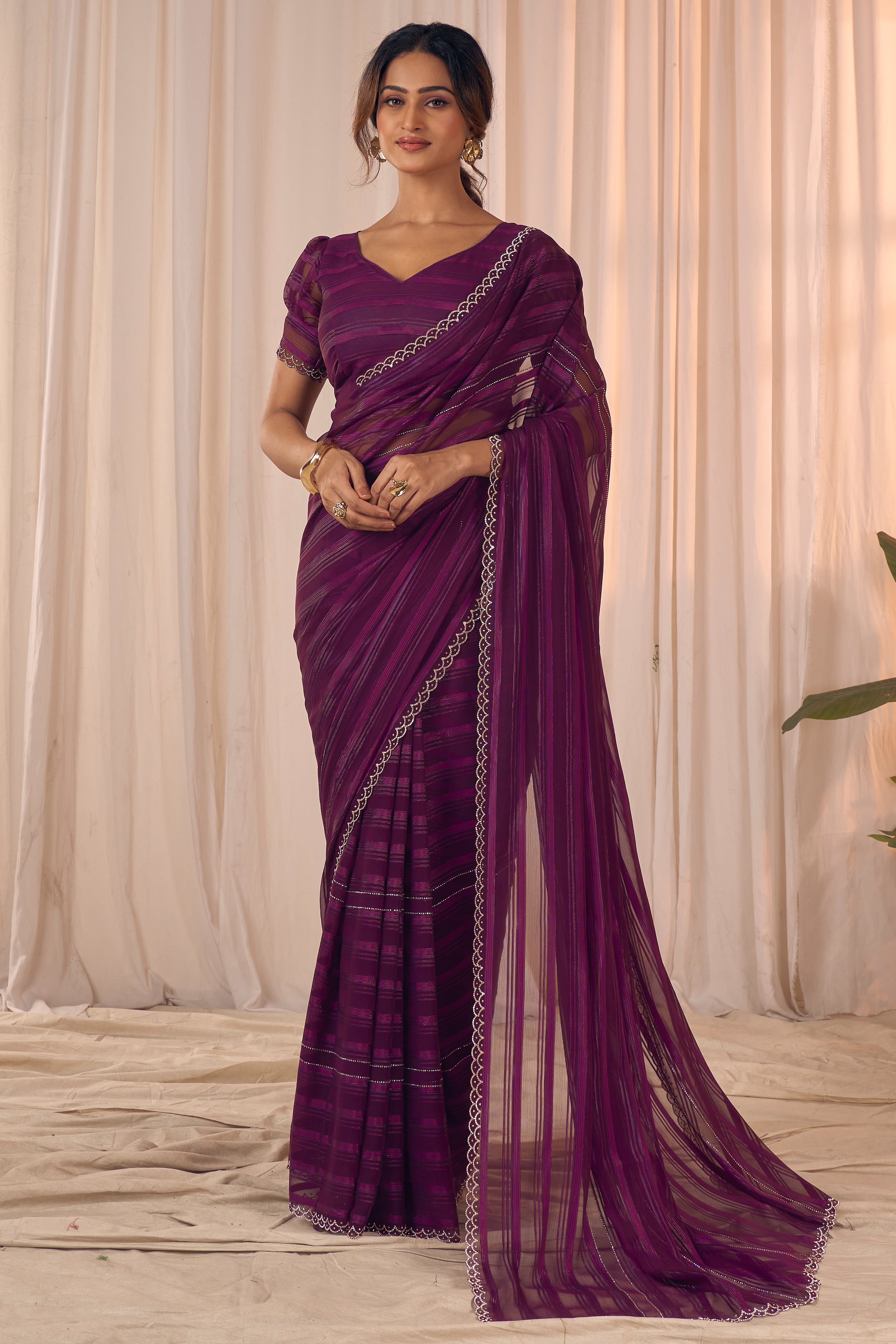 Wine Striped Designer Georgette Saree Adorned With An Elegant Zarkan Cutwork Border