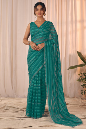 Teal Striped Designer Georgette Saree Adorned With An Elegant Zarkan Cutwork Border