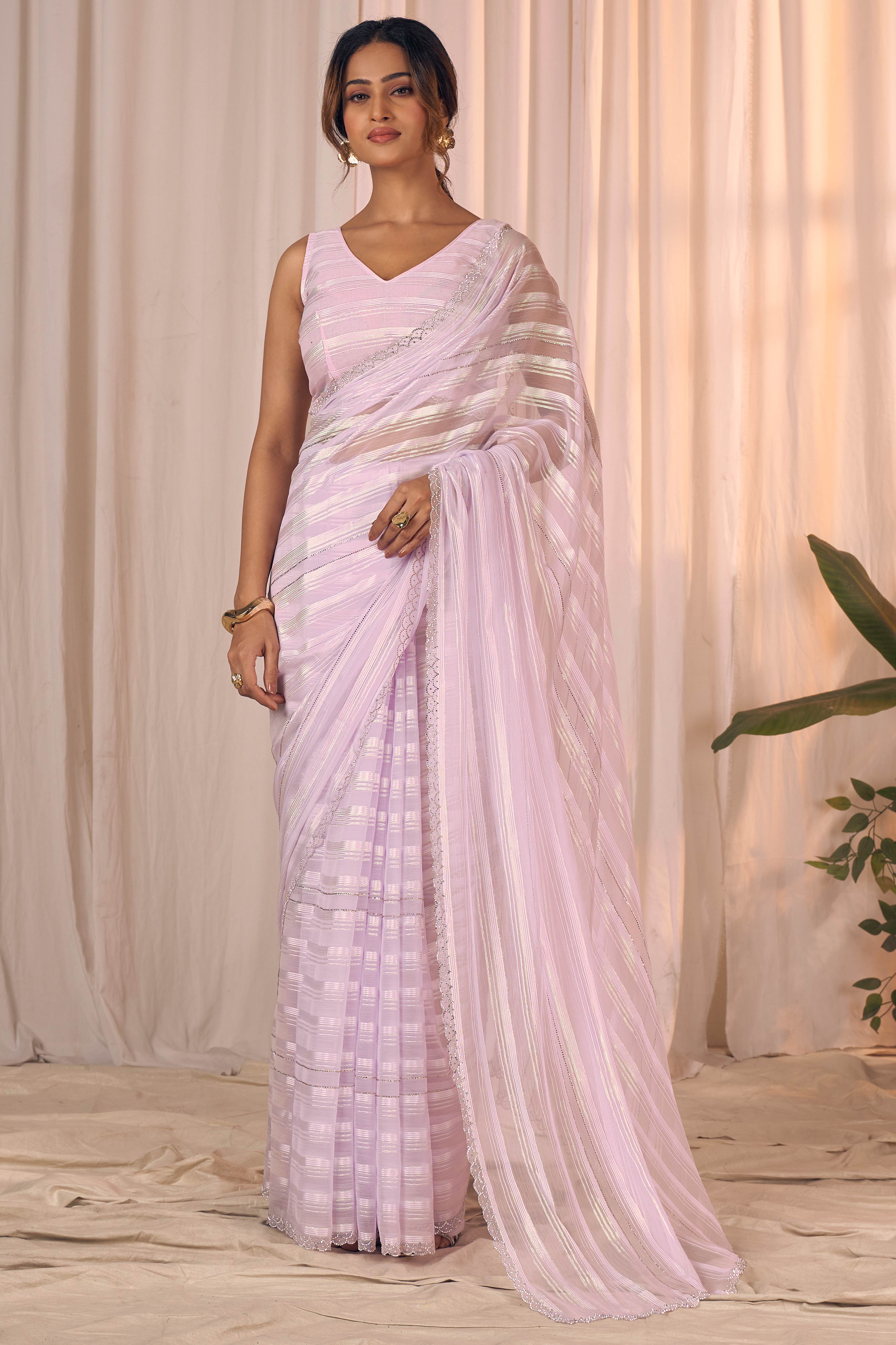 Light Lavender Striped Georgette Saree With Sparkling Zarkan Work & An Elegant Cutwork Border